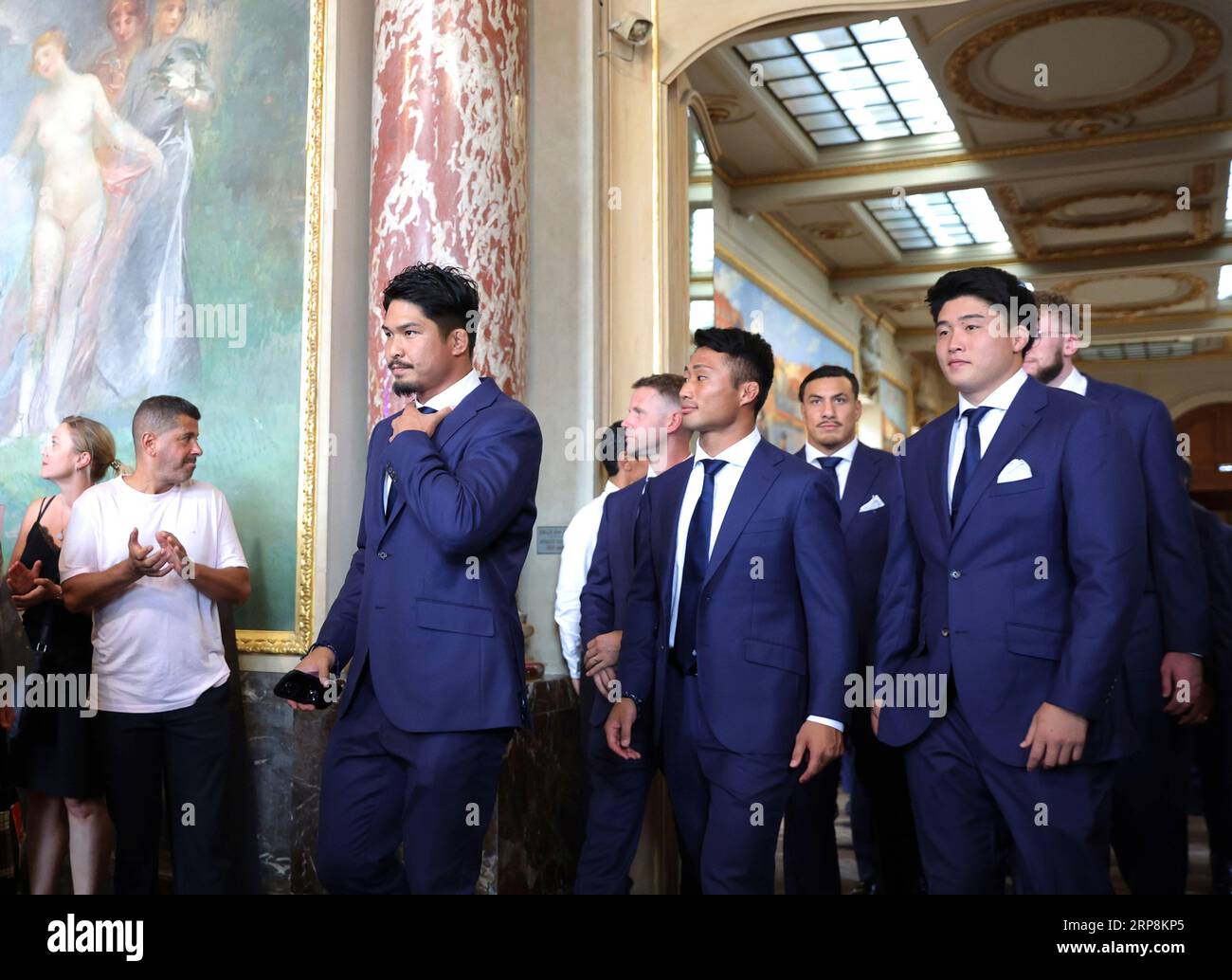 Kazuki Himeno (L) and other members of the Japanese national rugby union  team (Cherry Blossoms, Sakura  The Brave Blossoms) attend a welcome  ceremony at a city hall in Toulouse, France on