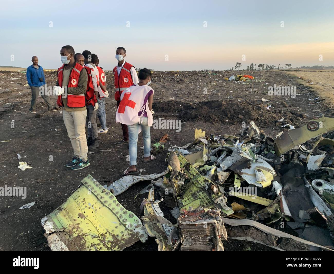 (190310) -- ADDIS ABABA, March 10, 2019 (Xinhua) -- Rescuers work beside the wreckage of an Ethiopian Airlines aircraft at the crash site, some 50 km east of Addis Ababa, capital of Ethiopia, on March 10, 2019. All 157 people aboard Ethiopian Airlines flight were confirmed dead as Africa s fastest growing airline witnessed the worst-ever incident in its history. The incident on Sunday, which involved a Boeing 737-800 MAX, occurred a few minutes after the aircraft took off from Addis Ababa Bole International Airport to Nairobi, Kenya. It crashed around Bishoftu town, the airline said. (Xinhua/W Stock Photo