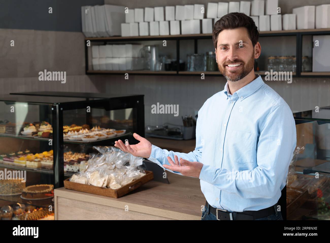 Portrait of happy business owner in bakery shop Stock Photo - Alamy