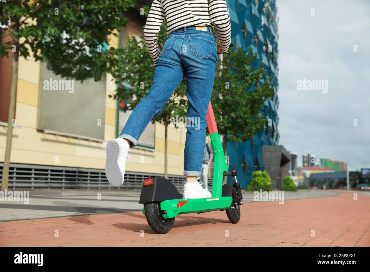 Woman riding on back scooter hi-res stock photography and images - Alamy