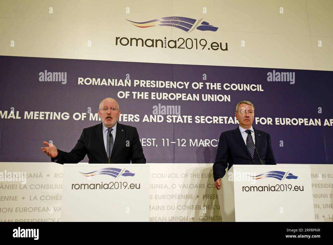 (190313) -- BUCHAREST, March 13, 2019 -- First Vice-President of the European Commission Frans Timmermans (L) attends a joint news conference with the Romanian Minister for European Affairs George Ciamba in Bucharest, Romania, March 12, 2019. The future Multiannual Financial Framework of the European Union (EU) must respond both to the priorities of the EU and to the unexpected new challenges, Timmermans said here on Tuesday. ) ROMANIA-BUCHAREST-EU-BUDGET CristianxCristel PUBLICATIONxNOTxINxCHN Stock Photo