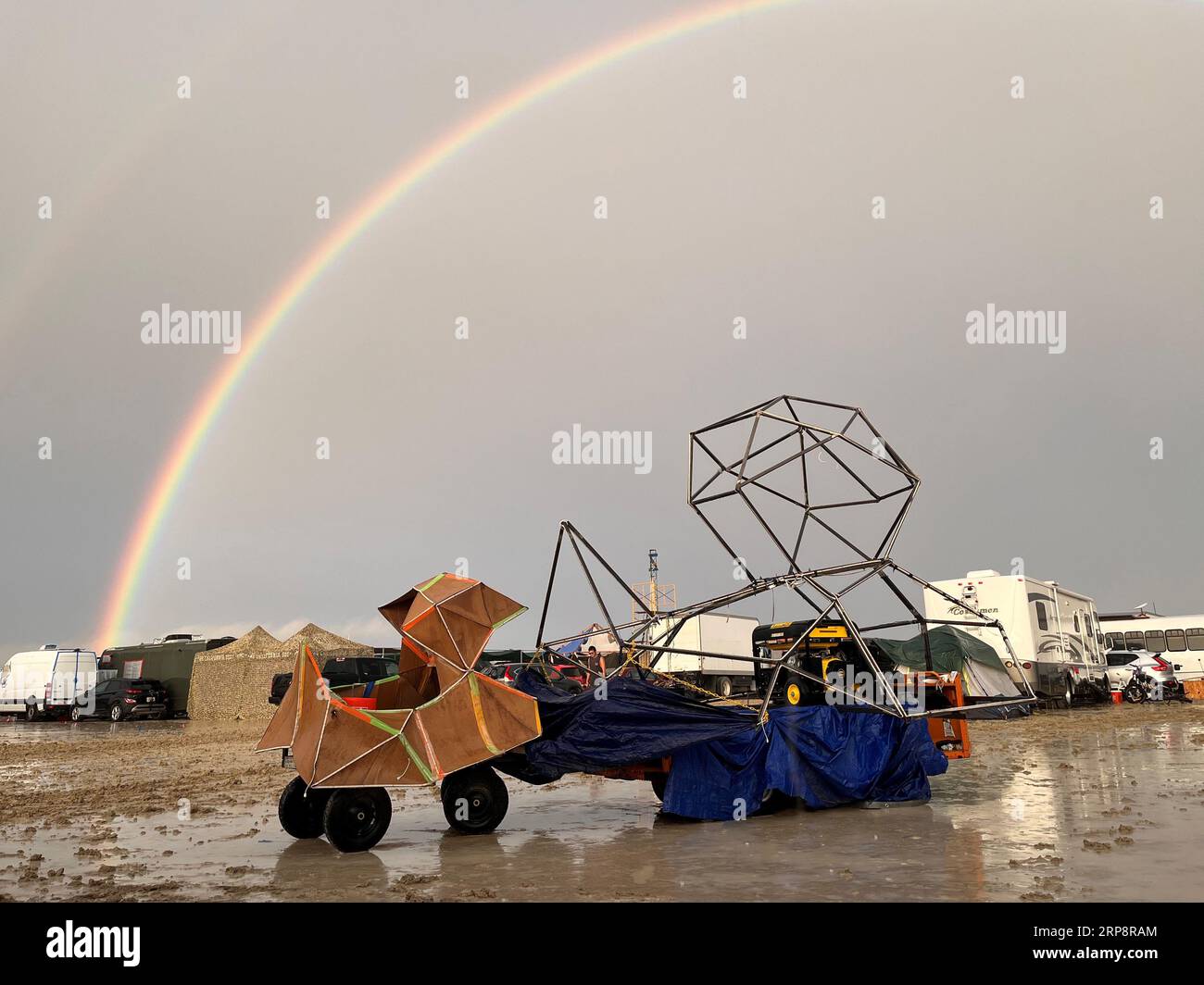 Black Rock, USA. 04th Sep, 2023. The undated image shows a rainbow seen over the muddy grounds of the 'Burning Man' festival. Tens of thousands of visitors to the desert festival 'Burning Man' are stranded on the site in the US state of Nevada after heavy rainfall over the weekend. Credit: David Crane/dpa/Alamy Live News Stock Photo