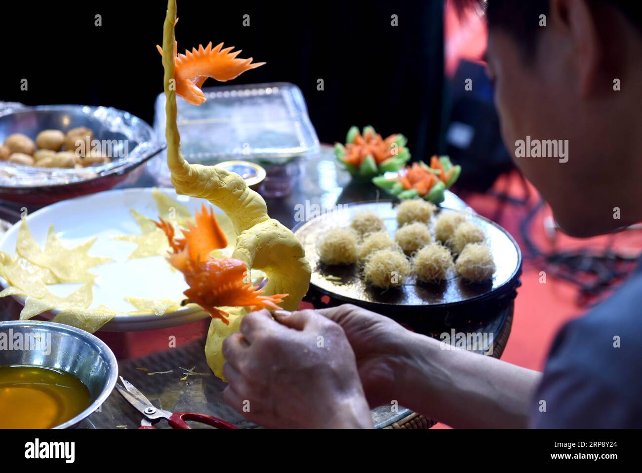 (190318) -- BEIJING, March 18, 2019 -- A cook prepares a tofu dish during a cooking contest in Huainan, east China s Anhui Province, Sept. 21, 2018. China s food and beverage (F&B) industry posted a record high of 4.27 trillion yuan (636 billion U.S. dollars) in revenue in 2018, the China Cuisine Association said Sunday. The F&B industry revenue accounted for 11.2 percent of the total volume of retail sales last year, up 0.4 percentage points from 2017, said Jiang Junxian, president of the association. The F&B industry also contributed 20.9 percent to consumption growth in 2018, he said. ) CHI Stock Photo