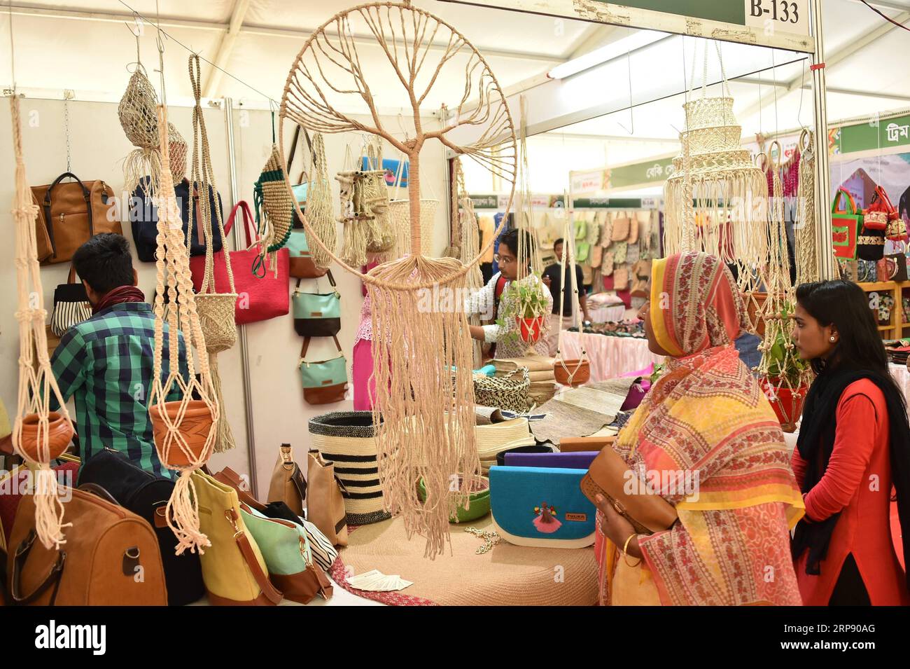 (190319) -- DHAKA, March 19, 2019 -- Visitors look at jute products at a stall during Bangladesh s National Small and Medium Enterprise (SME) Fair-2019 in Dhaka, capital of Bangladesh, March 19, 2019. The fair aimed at promoting the SME products and introduction of SME goods for expanding business, trade and commerce. The fair will open until March 22. Stringer) BANGLADESH-DHAKA-SME-FAIR Naim-ul-karim PUBLICATIONxNOTxINxCHN Stock Photo