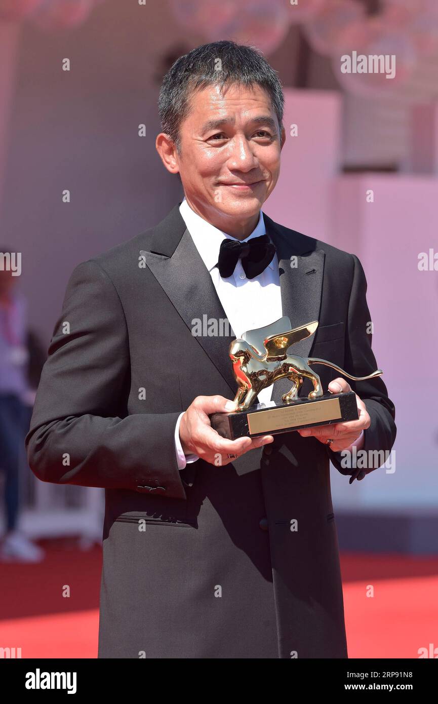 Venice, Italy. 02nd Sep, 2023. Tony Leung Chiu-wai attends a red carpet for the Golden Lion For Lifetime Achievement Award & 'The Lion's Share: A History Of The Mostra' at the 80th Venice International Film Festival on Saturday, September 2, 2023 in Venice, Italy. Photo by Rocco Spaziani/UPI Credit: UPI/Alamy Live News Stock Photo