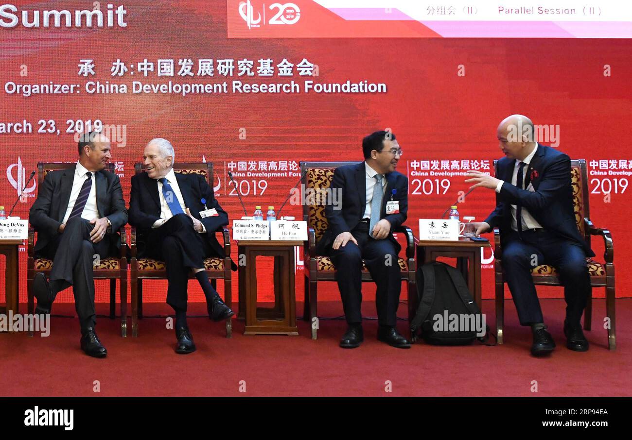 (190323) -- BEIJING, March 23, 2019 (Xinhua) -- Guests talk with each other during the Economic Summit of China Development Forum 2019 in Beijing, capital of China, March 23, 2019. The three-day China Development Forum, which kicked off Saturday, will focus on key issues such as the supply-side structural reform, new measures of proactive fiscal policy, and the opening-up of the financial sector and financial stability. More than 50 officials from the Chinese central government s departments and over 150 overseas delegates will participate in the forum, including 96 executives from the world s Stock Photo
