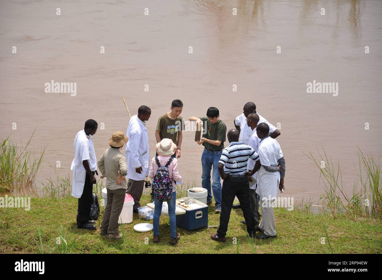 (190323) -- BEIJING, March 23, 2019 (Xinhua) -- Researchers from Nanjing Institute of Geography and Limnology of Chinese Academy of Sciences and experts from African institutions collect sample of water from a river in a reserve in Tanzania, March 3, 2014. The Sino-Africa Joint Research Center (SAJOREC), a talent cultivation and scientific research institute, was established in 2013 and covers some 40 acres of land. The Chinese Academy of Sciences has equipped SAJOREC to enhance its capacity to implement joint research projects. Since its establishment, 48 joint research projects focusing on b Stock Photo