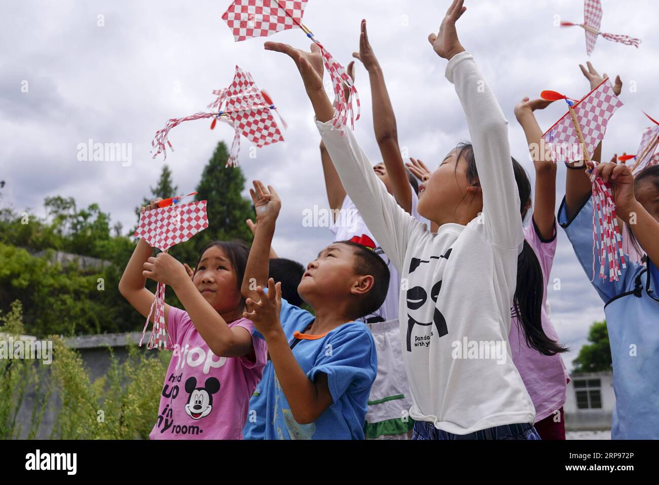 (190327) -- BEIJING, March 27, 2019 (Xinhua) -- Students conduct a test flight of aviation models at the primary school of Daba Village in Pengshui County, southwest China s Chongqing Municipality, Aug. 18, 2017. China s efforts to promote the balanced development of compulsory education, which usually means narrowing inter-regional, rural-urban or inter-school gaps in terms of education conditions and quality, has borne fruit, the Ministry of Education said Tuesday. According to the ministry, the balanced development of compulsory education has been achieved in 2,717 counties, representing 92 Stock Photo