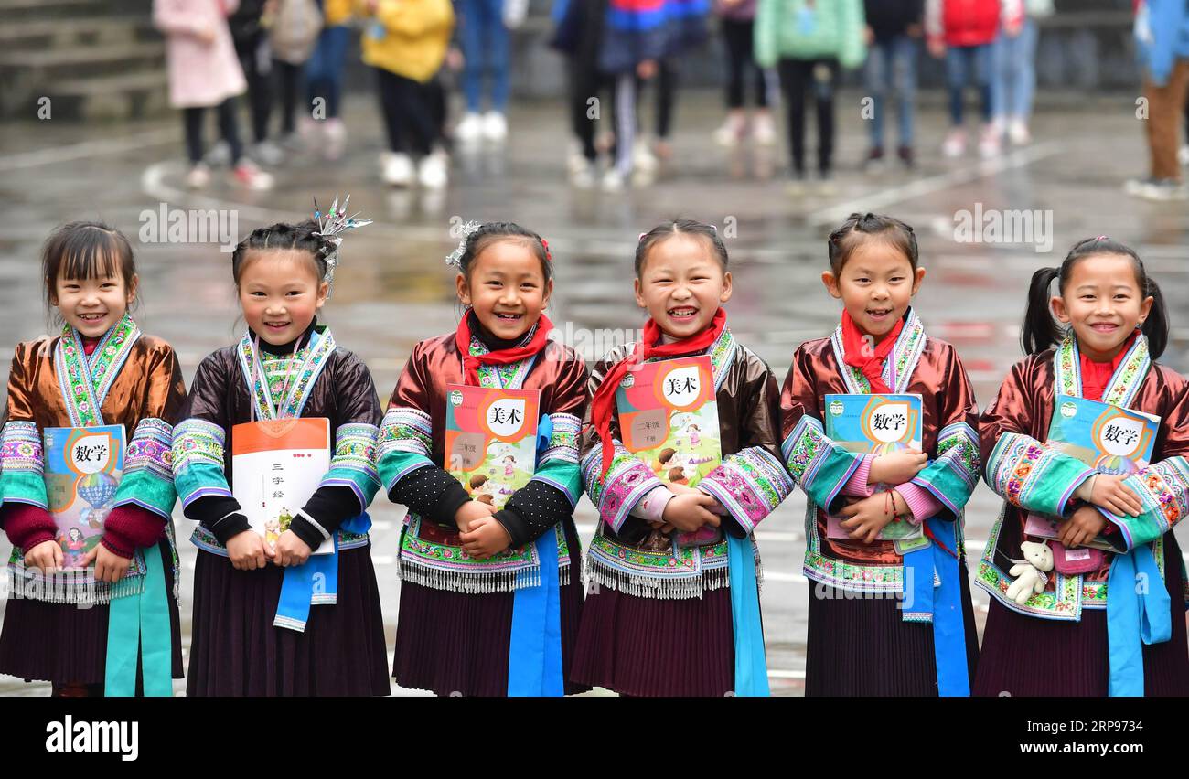 (190327) -- BEIJING, March 27, 2019 (Xinhua) -- Students pose for a group photo at the central school in Gandong Township in Miao Autonomous County of Rongshui, south China s Guangxi Zhuang Autonomous Region, March 14, 2019. China s efforts to promote the balanced development of compulsory education, which usually means narrowing inter-regional, rural-urban or inter-school gaps in terms of education conditions and quality, has borne fruit, the Ministry of Education said Tuesday. According to the ministry, the balanced development of compulsory education has been achieved in 2,717 counties, rep Stock Photo