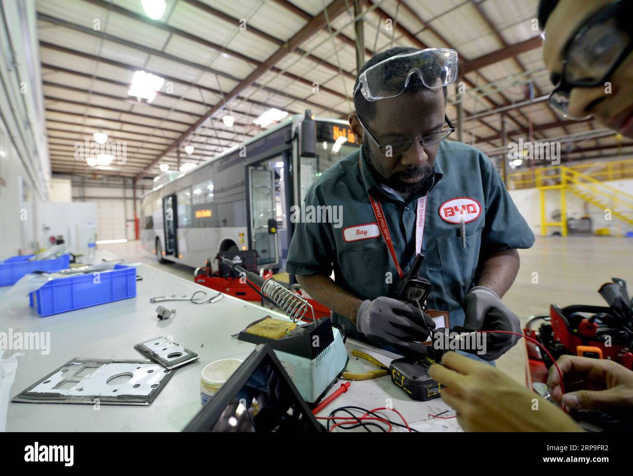 (190405) -- NEW YORK, April 5, 2019 (Xinhua) -- File photo taken on April 29, 2015 shows an engineer examining the circuit of an electric bus at BYD s manufacturing plant in Lancaster, Los Angeles County, the United States. China s leading electric vehicle maker BYD held a ceremony on April 3 to celebrate its 300th bus at its Lancaster manufacturing plant in the U.S. state of California, marking a milestone for production. The 300th bus, a 35-foot BYD K9S model transit bus, is one of three built for the Capital Area Transit System of Baton Rouge, capital of the U.S. state of Louisiana, the com Stock Photo