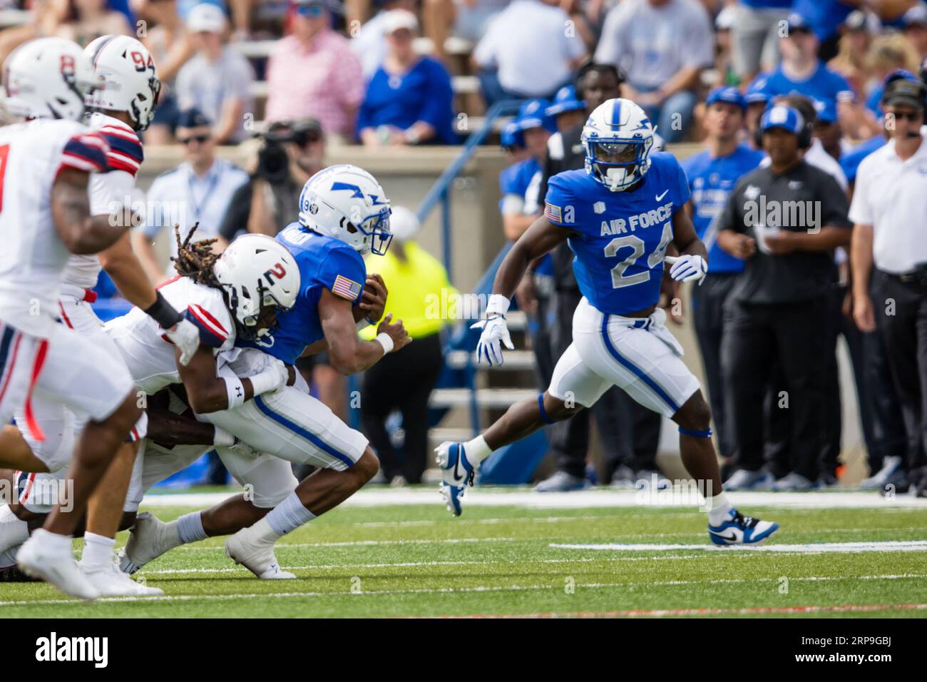 September 02, 2023: Air Force quarterback Zac Larrier (9) carries the ball while Robert Morris free safety Dee Pierce (2) tackles during a regular season NCAA football game between the Robert Morris Colonials and the Air Force Falcons on September 02, 2023, at Falcon Stadium in United States Air Force Academy, CO. Mat Gdowski/CSM (Credit Image: © Mat Gdowski/Cal Sport Media) Stock Photo