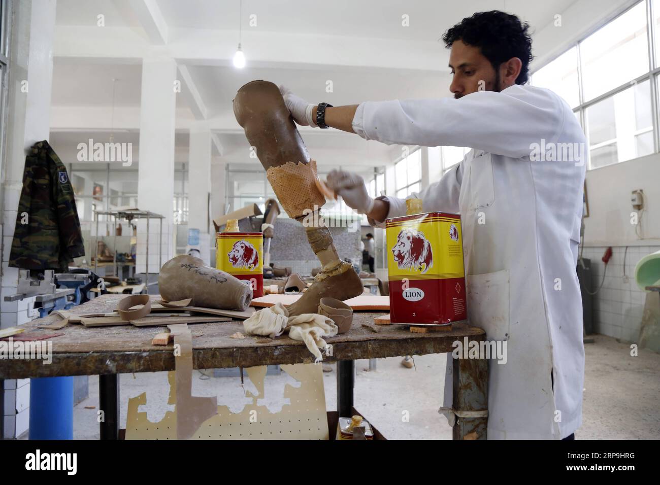 (190407) -- SANAA, April 7, 2019 -- A technician prepares a prosthetic limb at a rehabilitation center in Sanaa, Yemen, on April 7, 2019. Large swathes of Yemen have been swamped by randomly-planted landmines, which are posing a lingering threat to the lives of citizens across the war-torn country. According to the United Nations, thousands of landmines, unexploded ordnance and other explosive war remnants have been left behind during the ongoing conflict in Yemen which has just entered its fifth year. ) YEMEN-SANAA-LANDMINES-VICTIMS MohammedxMohammed PUBLICATIONxNOTxINxCHN Stock Photo