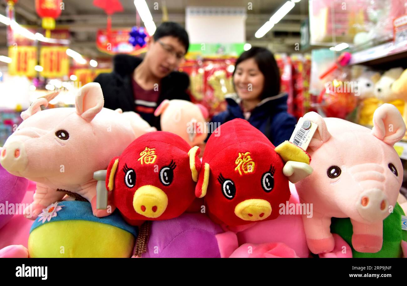 (190409) -- BEIJING, April 9, 2019 (Xinhua) -- Customers select pig-shaped plush toys in Handan, north China s Hebei Province, Feb. 2, 2019. China is likely to witness a rebound in births this year because of people s favorable attitude toward having a baby in the Year of the Pig, Tuesday s China Daily reported. It is almost certain the number of births this year will be higher. Traditionally, population peaks occur during the Year of the Pig, Xu Congjian, president of Shanghai-based Obstetrics and Gynecology Hospital at Fudan University. A traditional belief exists in many areas of China that Stock Photo