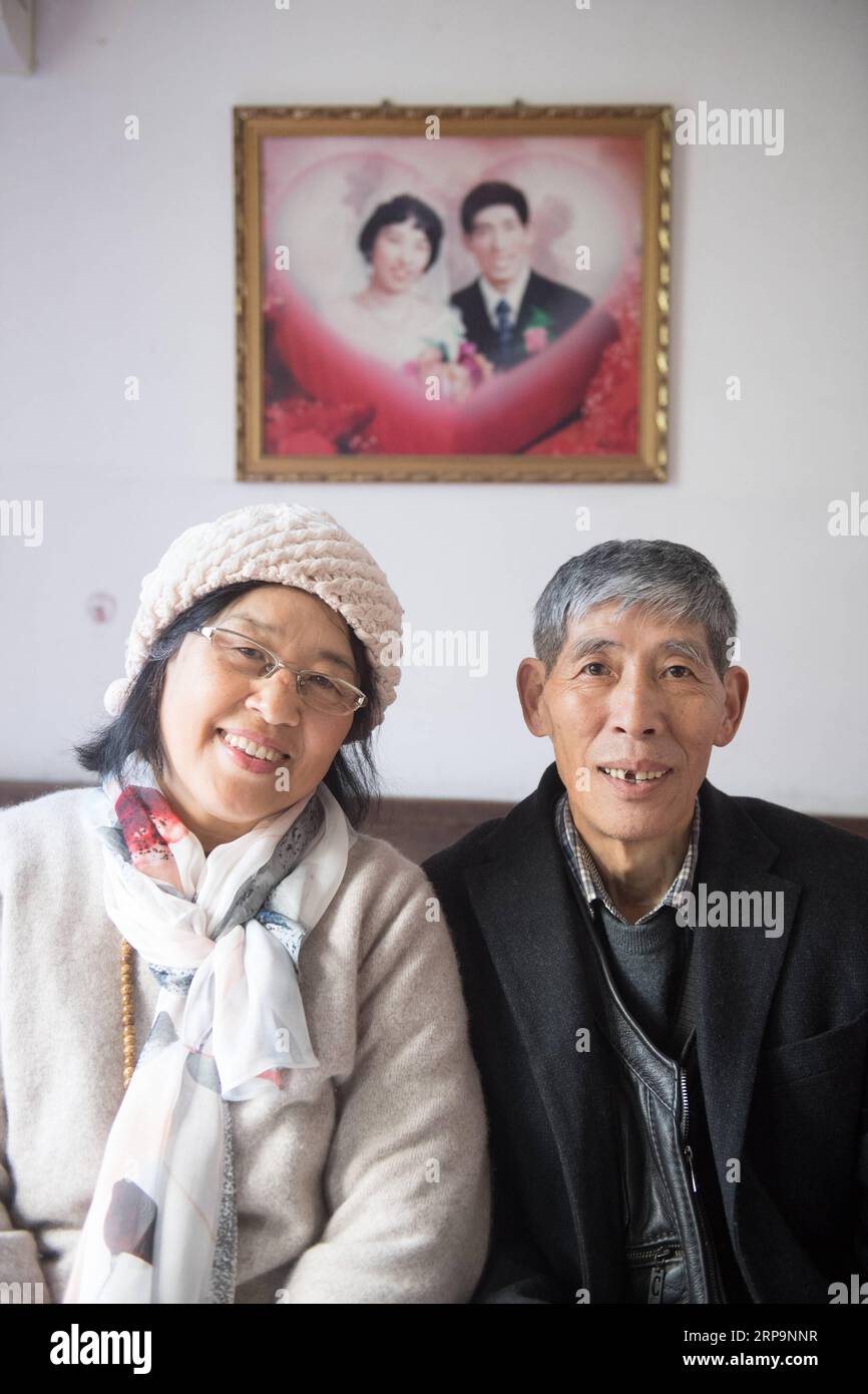 (190413) -- TONGLU, April 13, 2019 (Xinhua) -- Wu Suhuan (L) and her husband pose for photos at home in Tonglu Count, east China s Zhejiang Province, April 11, 2019. Wu Suhuan, 65, is a progressive muscular atrophy patient and has been paralyzed for decades. Dedicated to working as a narrator for barrier-free movies, she has so far wrote scripts for four movies and read them along with the movie for the visually impaired since 2015. I feel happy and fulfilled in helping them, said Wu. (Xinhua/Weng Xinyang) CHINA-ZHEJIANG-BARRIER-FREE MOVIE-VOLUNTEER (CN) PUBLICATIONxNOTxINxCHN Stock Photo