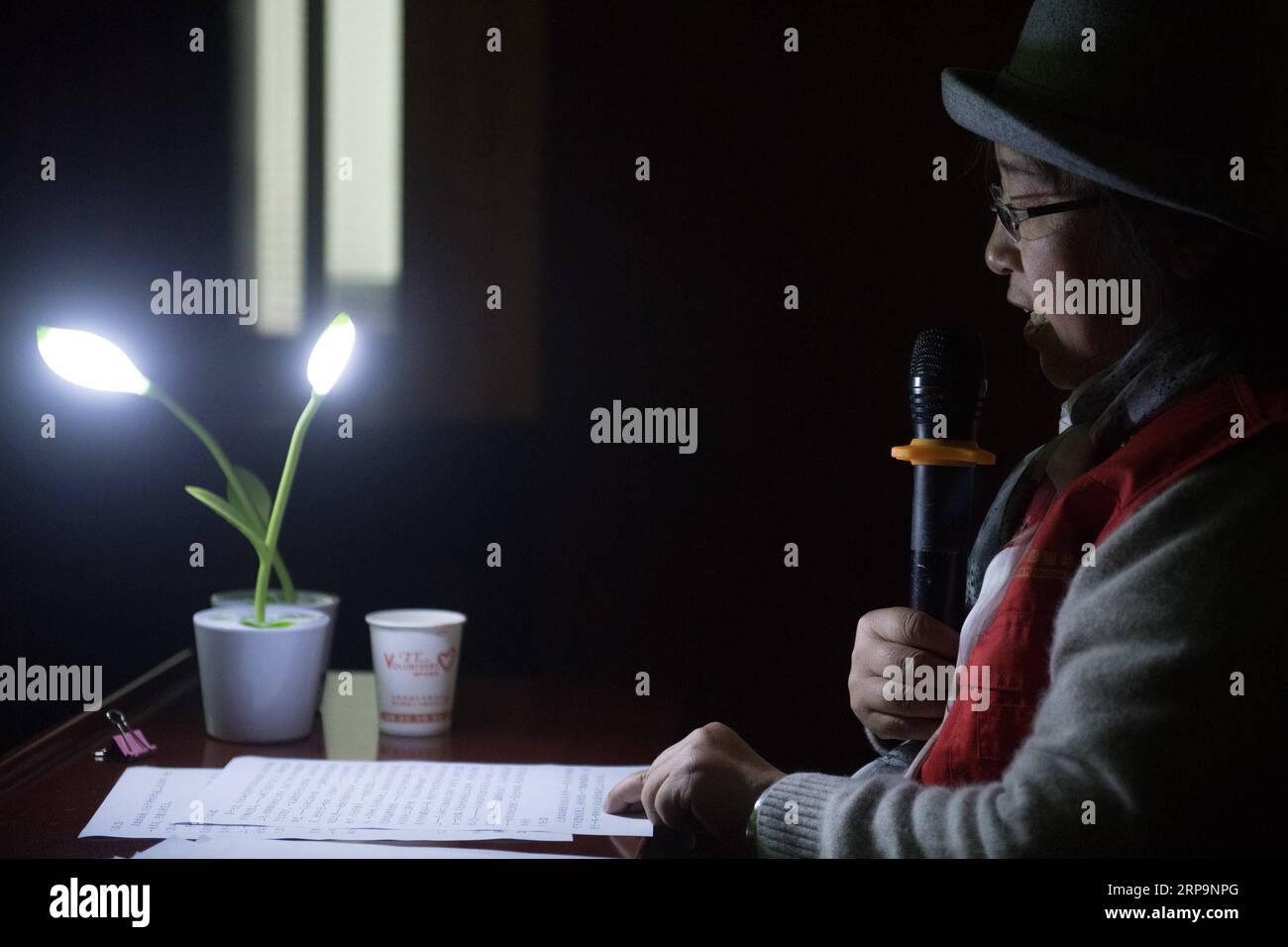 (190413) -- TONGLU, April 13, 2019 (Xinhua) -- Wu Suhuan reads her script to narrate the film Kekexili: Mountain Patrol for visually impaired people in Tonglu Branch of China Braille Library in Tonglu County, east China s Zhejiang Province, April 11, 2019. Wu Suhuan, 65, is a progressive muscular atrophy patient and has been paralyzed for decades. Dedicated to working as a narrator for barrier-free movies, she has so far wrote scripts for four movies and read them along with the movie for the visually impaired since 2015. I feel happy and fulfilled in helping them, said Wu. (Xinhua/Weng Xinyan Stock Photo