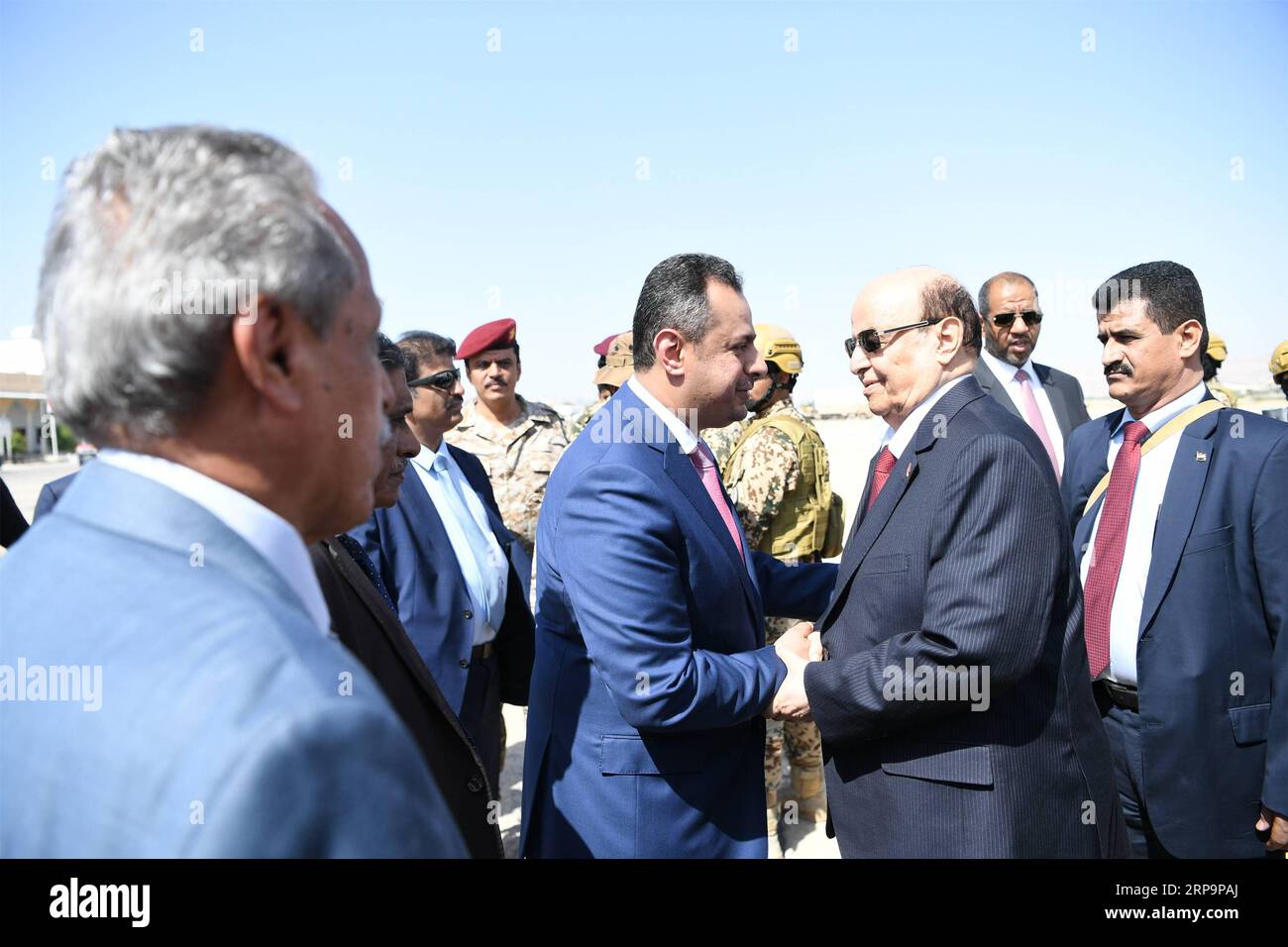 (190413) -- SEIYUN (YEMEN), April 13, 2019 -- Yemeni President Abdu-Rabbu Mansour Hadi (2nd R, front) shakes hands with Yemeni Prime Minister Maeen Abdulmalik (3rd R, front) upon his arrival at the airport in Seiyun city of Hadramout province, Yemen, on April 13, 2019. Yemen s parliament convened on Saturday in the city of Seiyun, the second largest city in the southeastern province of Hadramout, for the first time since the outbreak of the devastating civil war in the impoverished Arab country in March 2015. ) YEMEN-SEIYUN-PARLIAMENT MEETING IsmailxRabidhy PUBLICATIONxNOTxINxCHN Stock Photo