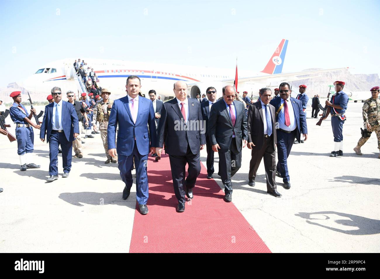 (190413) -- SEIYUN (YEMEN), April 13, 2019 -- Yemeni President Abdu-Rabbu Mansour Hadi (2nd L, front) walks with Prime Minister Maeen Abdulmalik (1st L, front) and other officials upon his arrival at the airport in Seiyun city of Hadramout province, Yemen, on April 13, 2019. Yemen s parliament convened on Saturday in the city of Seiyun, the second largest city in the southeastern province of Hadramout, for the first time since the outbreak of the devastating civil war in the impoverished Arab country in March 2015. ) YEMEN-SEIYUN-PARLIAMENT MEETING IsmailxRabidhy PUBLICATIONxNOTxINxCHN Stock Photo