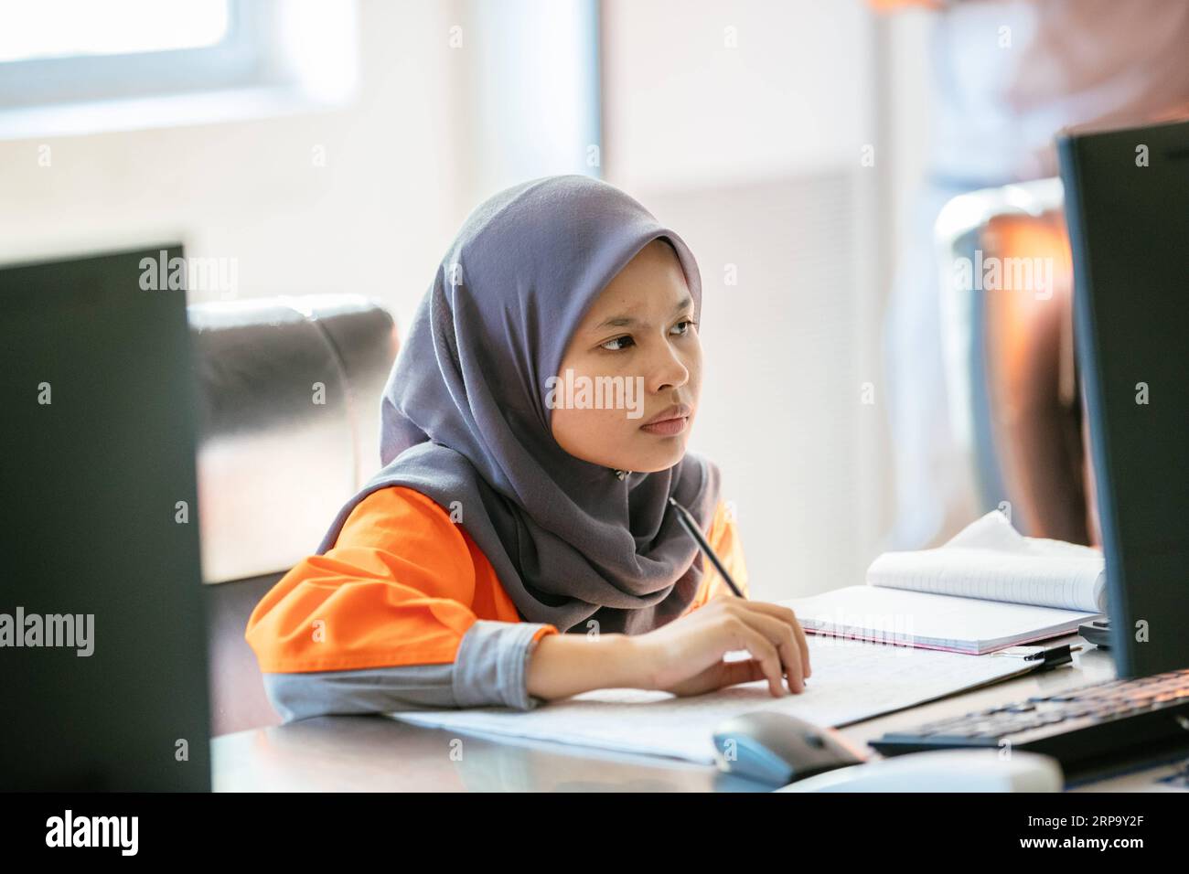 (190419) -- KUALA LUMPUR, April 19, 2019 (Xinhua) -- Nur Fatihah Binti Zakaria works at the coal preparation central control room at the Alliance Steel coking plant in Kuantan, Malaysia, April 15, 2019. At the beginning Malaysian college graduate Nur Fatihah Binti Zakaria had no idea about what steel production was all about, nor did she have any knowledge about speaking Chinese. But after almost two years working at the Alliance Steel at the Malaysia, China Kuantan Industrial Park, she now can perform her job skillfully, even making fun of her colleagues from China that not all of them speak Stock Photo