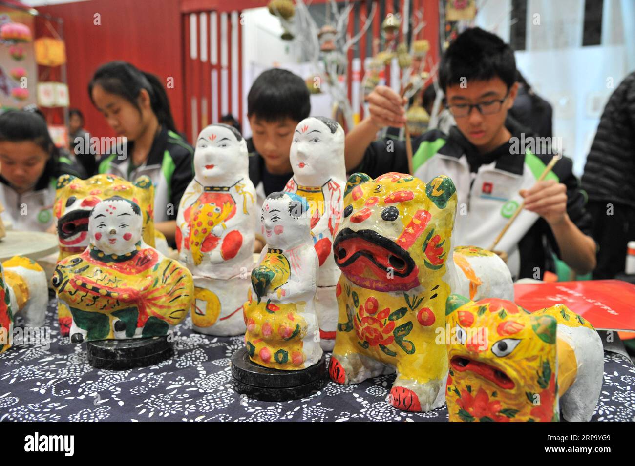 (190419) -- WEIFANG, April 19, 2019 (Xinhua) -- Photo taken on April 19, 2019 shows the clay sculpture works during the 4th China (Weifang) folk art fair in Weifang, east China s Shandong Province. The 4th China (Weifang) folk art fair kicked off here on Friday. More than 50 categories of folk art were displayed and visitors could have a try at the interactive exhibition area. (Xinhua/Shao Kun) CHINA-SHANDONG-FOLK ART-FAIR (CN) PUBLICATIONxNOTxINxCHN Stock Photo