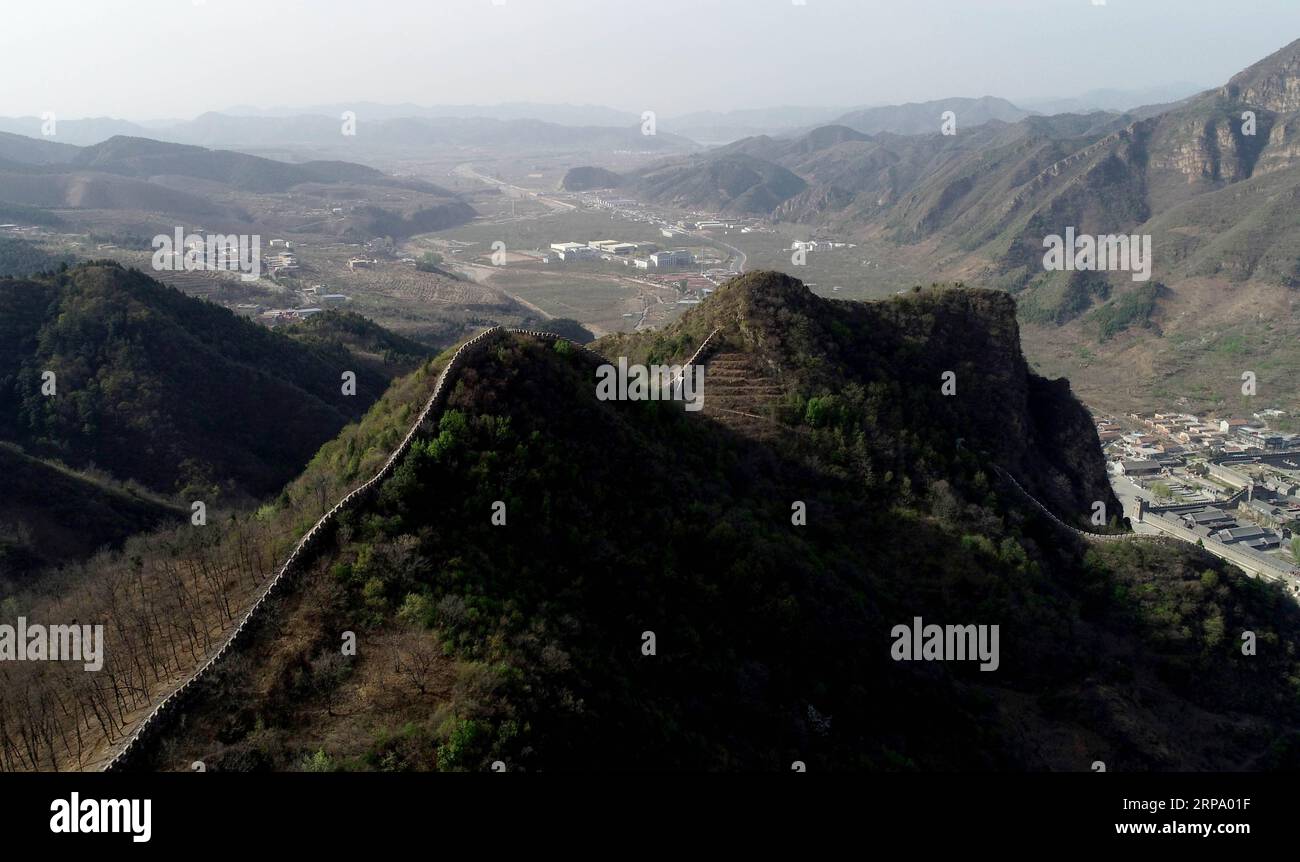 (190420) -- TIANJIN, April 20, 2019 (Xinhua) -- Aerial photo taken on April 19, 2019 shows the Huangyaguan Great Wall in the northern suburb of Tianjin, north China. The Huangyaguan Great Wall was built more than 14 centuries ago for border defense purpose. The structure winds its way for about 3,000 meters along the mountain areas of today s Jizhou District on the outskirts of Tianjin. (Xinhua/Yue Yuewei) CHINA-TIANJIN-HUANGYAGUAN GREAT WALL (CN) PUBLICATIONxNOTxINxCHN Stock Photo