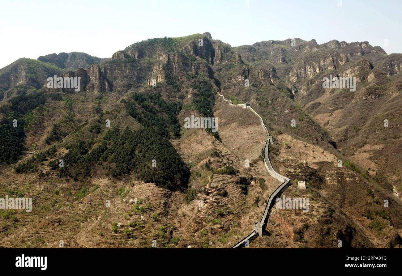 (190420) -- TIANJIN, April 20, 2019 (Xinhua) -- Aerial photo taken on April 19, 2019 shows the western end of the Huangyaguan Great Wall in the northern suburb of Tianjin, north China. The Huangyaguan Great Wall was built more than 14 centuries ago for border defense purpose. The structure winds its way for about 3,000 meters along the mountain areas of today s Jizhou District on the outskirts of Tianjin. (Xinhua/Yue Yuewei) CHINA-TIANJIN-HUANGYAGUAN GREAT WALL (CN) PUBLICATIONxNOTxINxCHN Stock Photo