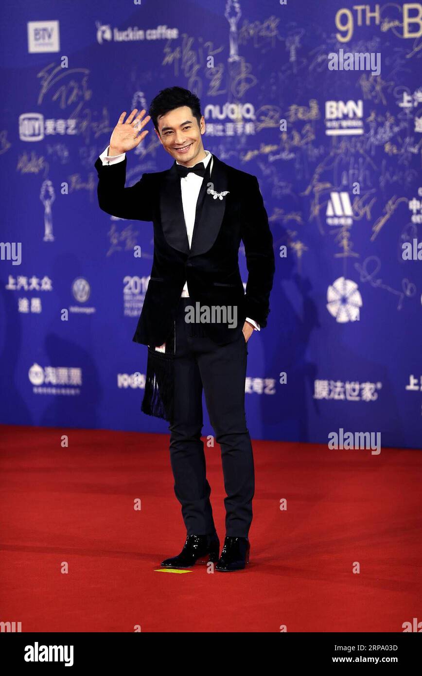 (190420) -- BEIJING, April 20, 2019 (Xinhua) -- Actor Huang Xiaoming poses for photos on the red carpet for the closing ceremony of the ninth Beijing International Film Festival in Beijing, capital of China, April 20, 2019. (Xinhua/Meng Yongmin) CHINA-BEIJING-INT L FILM FESTIVAL-CLOSING (CN) PUBLICATIONxNOTxINxCHN Stock Photo