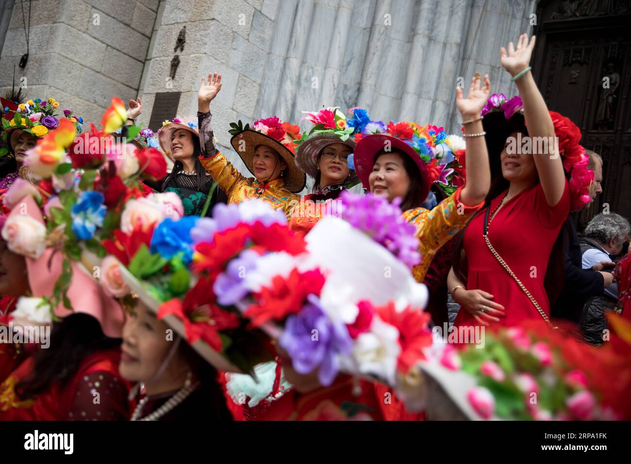 (190421) -- NEW YORK, April 21, 2019 -- Members of the Chinese Qipao Society of New York pose for photographs during the annual Easter Parade and Easter Bonnet Festival in New York, the United States, April 21, 2019. Adults, children and even pets in creative colorful bonnets and outfits participated in the annual Easter Parade and Easter Bonnet Festival in New York on Sunday, which attracted thousands of local residents and tourists. The pageant is a New York City tradition that stretches back to the 1870s. ) U.S.-NEW YORK-EASTER PARADE-BONNET FESTIVAL MichaelxNagle PUBLICATIONxNOTxINxCHN Stock Photo