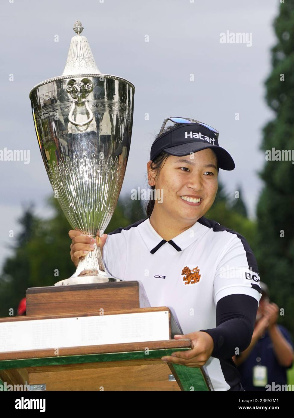 Wannasaen of Thailand holds the victor's trophy after winning