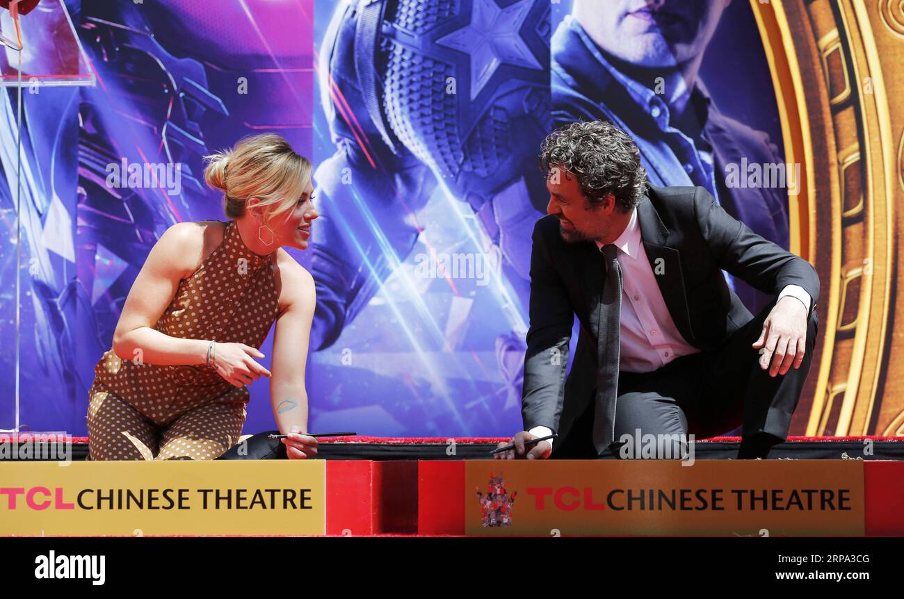 (190424) -- LOS ANGELES, April 24, 2019 (Xinhua) -- Actress Scarlett Johansson (L) and actor Mark Ruffalo attend their print ceremony in the forecourt of the TCL Chinese Theater in Los Angeles, the United States, April 23, 2019. The cast of Marvel Studios Avengers: Endgame including Robert Downey Jr., Chris Evans, Mark Ruffalo, Chris Hemsworth, Scarlett Johansson, and Jeremy Renner, along with Marvel Studios President Kevin Feige, received one of Hollywood s oldest accolades this Tuesday, to sign their names and put their handprints in cement at the TCL Chinese Theater IMAX in Hollywood. (Xinh Stock Photo