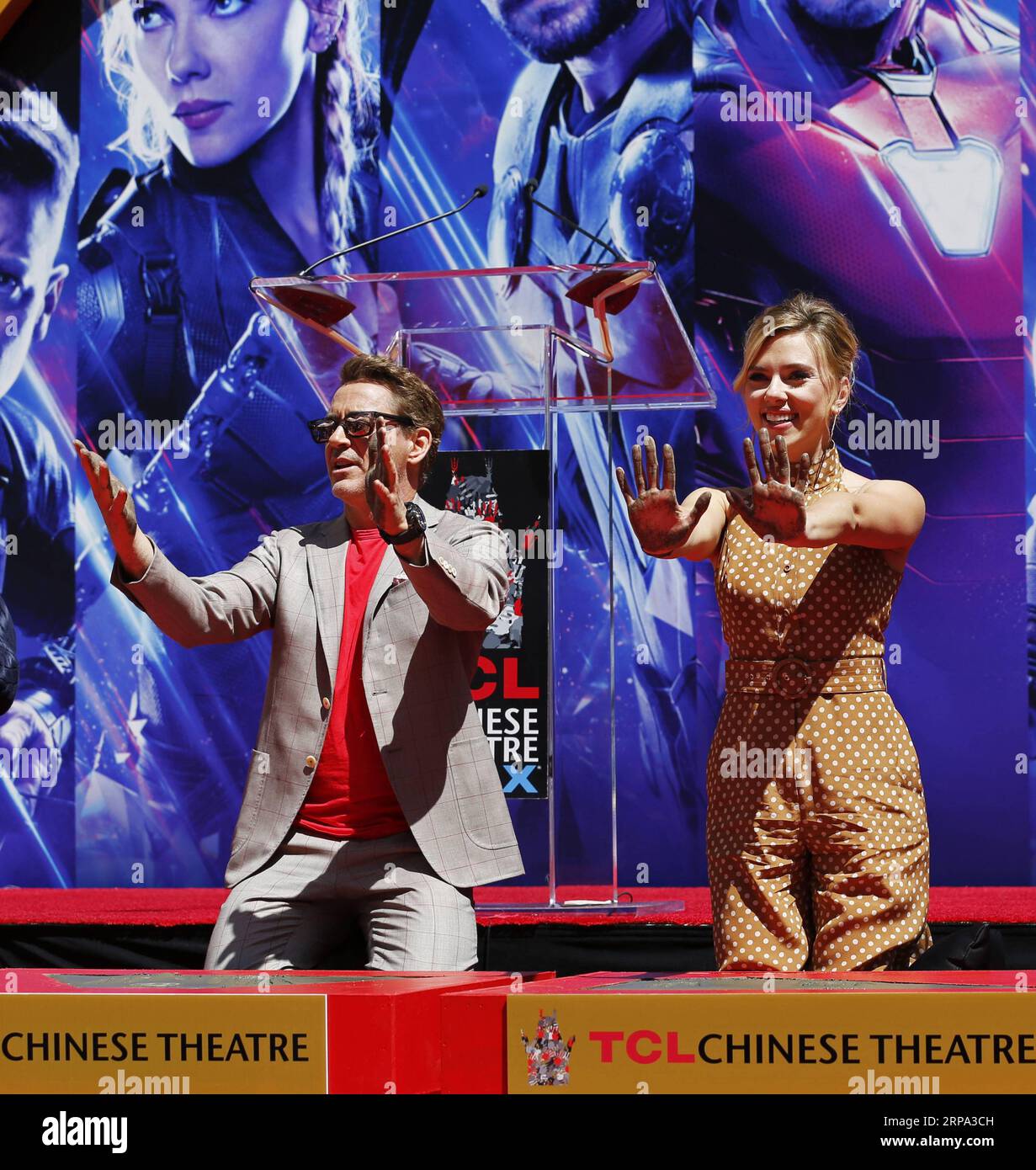 (190424) -- LOS ANGELES, April 24, 2019 (Xinhua) -- Actor Robert Downey Jr. (L) and actress Scarlett Johansson show their hands after putting their handprints in cement during print ceremony in the forecourt of the TCL Chinese Theater in Los Angeles, the United States, April 23, 2019. The cast of Marvel Studios Avengers: Endgame including Robert Downey Jr., Chris Evans, Mark Ruffalo, Chris Hemsworth, Scarlett Johansson, and Jeremy Renner, along with Marvel Studios President Kevin Feige, received one of Hollywood s oldest accolades this Tuesday, to sign their names and put their handprints in c Stock Photo