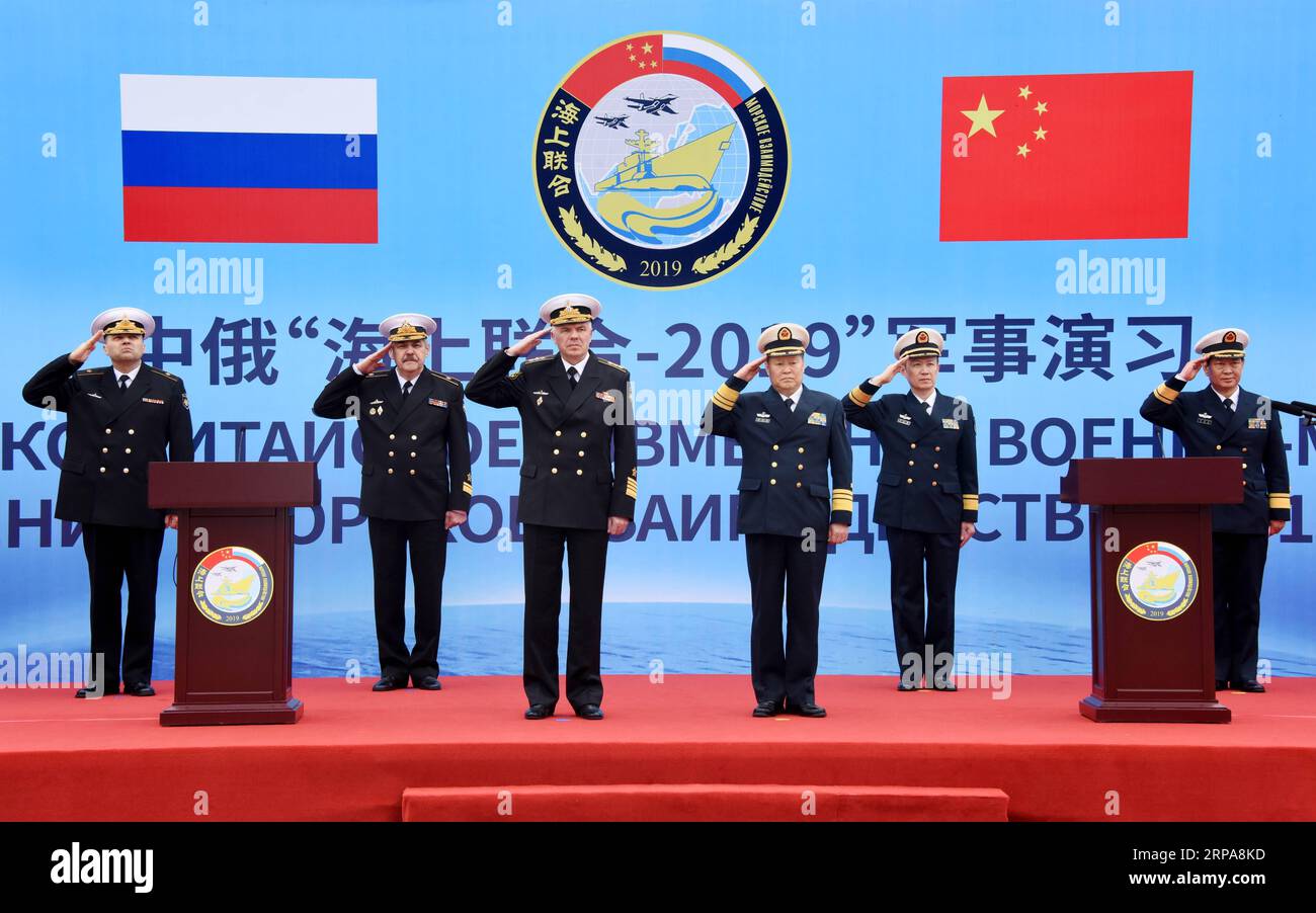 (190429) -- QINGDAO, April 29, 2019 (Xinhua) -- Representatives of both China and Russia salute at the welcome ceremony for Russian navy vessels in Qingdao, east China s Shandong Province, April 29, 2019. Russian naval vessels arrived in Qingdao on Monday to participate in the Sino-Russian Joint Sea-2019 exercise. The exercise will focus on joint sea defense, which aims to consolidate and develop the China-Russia comprehensive strategic partnership of coordination, deepen pragmatic naval cooperation, and improve their capabilities to jointly respond to security threats at sea. Two submarines, Stock Photo