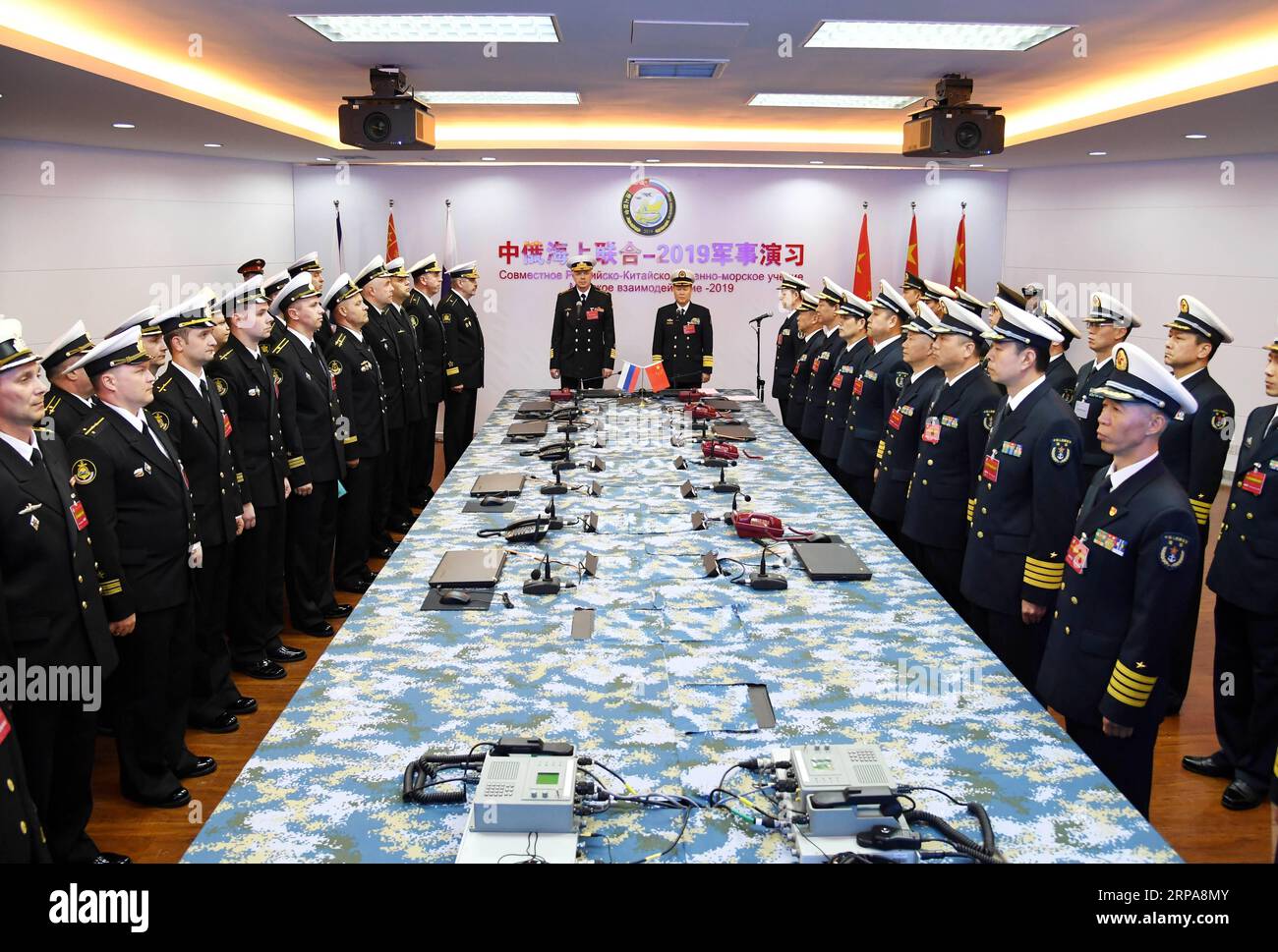 (190429) -- QINGDAO, April 29, 2019 (Xinhua) -- Qiu Yanpeng (C, R), chief director of Joint Sea-2019 exercise from the Chinese side and deputy commander of the Chinese People s Liberation Army (PLA) Navy, declares the opening of the Sino-Russian Joint Sea-2019 exercise in Qingdao, east China s Shandong Province, April 29, 2019. Russian naval vessels arrived in Qingdao on Monday to participate in the Sino-Russian Joint Sea-2019 exercise. The exercise will focus on joint sea defense, which aims to consolidate and develop the China-Russia comprehensive strategic partnership of coordination, deepe Stock Photo