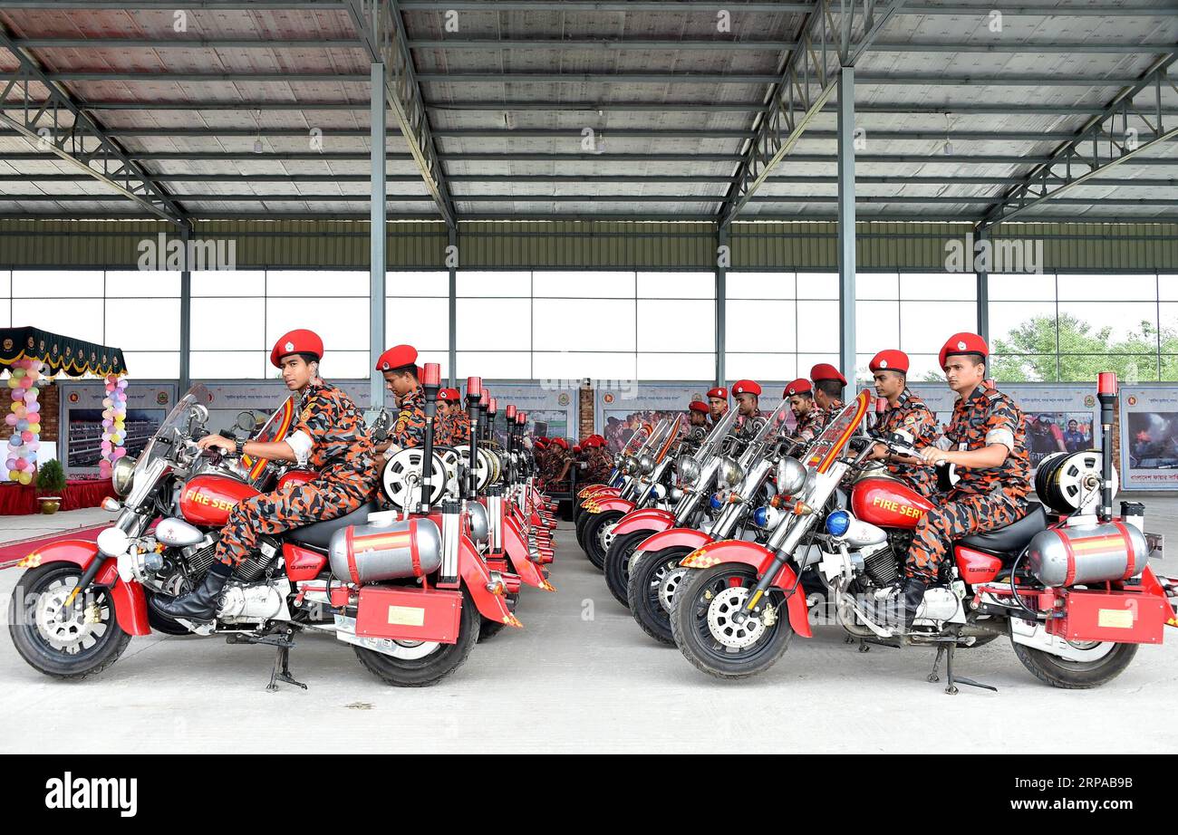 (190502) -- DHAKA, May 2, 2019 -- Bangladeshi firefighters attend a handover ceremony of 1,000 firefighting motorcycles donated by the Chinese government in Purbachal, Bangladesh, May 2, 2019. China on Thursday donated 1,000 firefighting motorcycles to Bangladesh in a bid to help strengthen the operational capability of Bangladesh s fire service and civil defense. Chen Wei, charge d affaires of the Chinese Embassy in Bangladesh, handed over the motorcycles to the Bangladesh authorities at a ceremony at Purbachal, a new township on the eastern side of capital Dhaka. Stringer) BANGLADESH-DHAKA-C Stock Photo