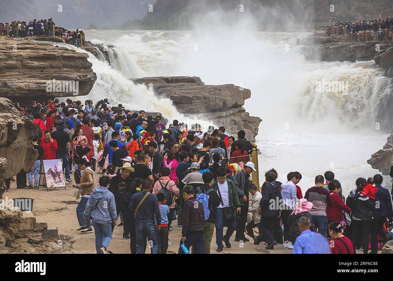 (190503) -- YAN AN, May 3, 2019 (Xinhua) -- Tourists visit the Hukou Waterfall scenic area in Yichuan County, northwest China s Shaanxi Province, may 3, 2019. People across China take advantage of the four-day Labor Day national holiday to get relaxed in recreational activities. (Xinhua/Lan Hua) CHINA-LABOR DAY-HOLIDAY-RECREATION (CN) PUBLICATIONxNOTxINxCHN Stock Photo