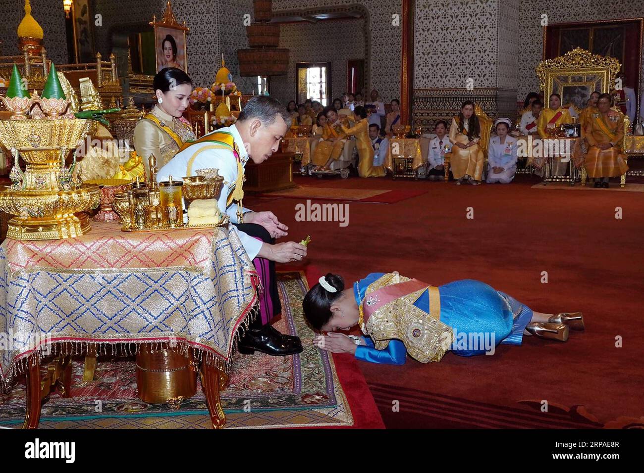 (190506) -- BANGKOK, May 6, 2019 -- Thai King Maha Vajiralongkorn pours sacred water on the head of Princess Bajrakitiyabha to grant new title and royal medals to her in Grand Palace, Bangkok, Thailand, on May 5, 2019. Thailand s newly crowned King Maha Vajiralongkorn on Sunday granted new titles to the members of the royal family after he was crowned in the Baisal Daksin Throne Hall of the Grand Palace in Bangkok on Saturday. Bureau of the Royal Household) THAILAND-BANGKOK-ROYAL FAMILY-TITLES RachenxSageamsak PUBLICATIONxNOTxINxCHN Stock Photo