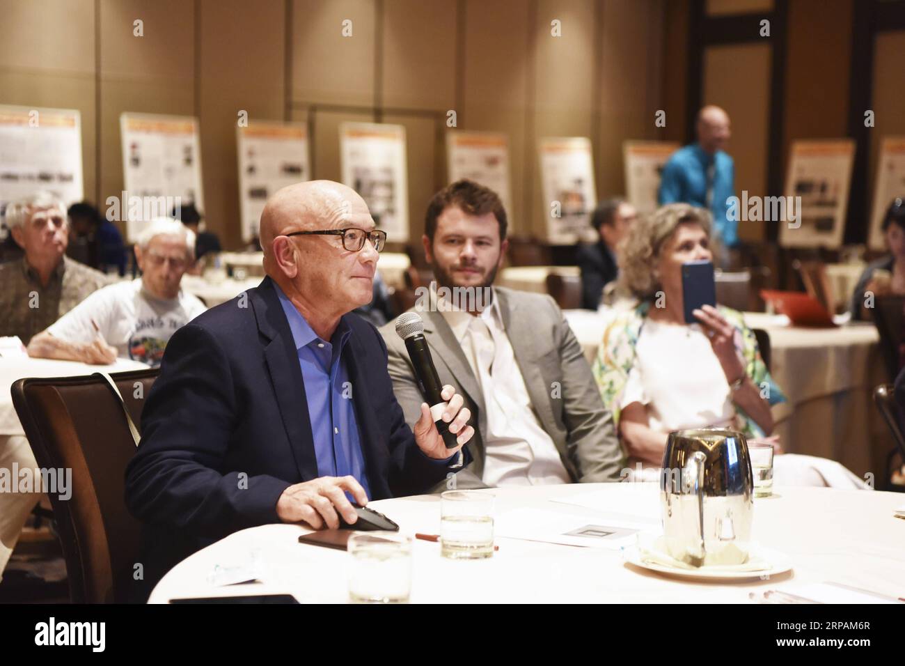 (190514) -- NEW YORK, May 14, 2019 -- James Bryant (L, front) delivers a speech at the 4th Sino-American Second World War Friendship and Flying Tiger History Conference in Las Vegas, the United States, May 11, 2019. James Bryant will never forget the day when his 93-year-old father went back to his bedroom and came back with a flight brief case containing papers related to the training and assignments he took as a U.S. Flying Tiger pilot during the World War II. As a remarkable yet humble man and a loving father, James E. Bryant did not show any detailed evidence about his war experience until Stock Photo