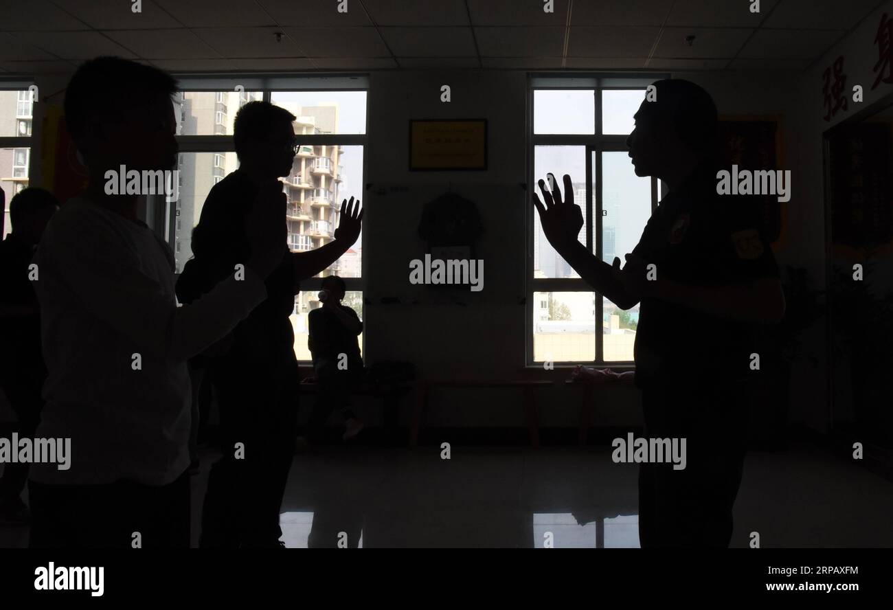 190521 -- JINAN, May 21, 2019 Xinhua -- Lu Weide 1st R instructs his students in practicing Yong Chun martial arts in Jinan of east China s Shandong Province, April 20, 2019. Lu Weide, a 74-year-old man from Hong Kong, is in his fifth year in Jinan, capital of northeast China s Shandong Province for both his beloved wife and his passion in Yong Chun martial arts. Lu started practicing martial arts like Taijiquan in his childhood. While working for the ICAC in Hong Kong in the 1980s, he got acquainted with Ye Zhun, the eldest son of Ye Wen, the master of Yong Chun in China, who was teaching to Stock Photo