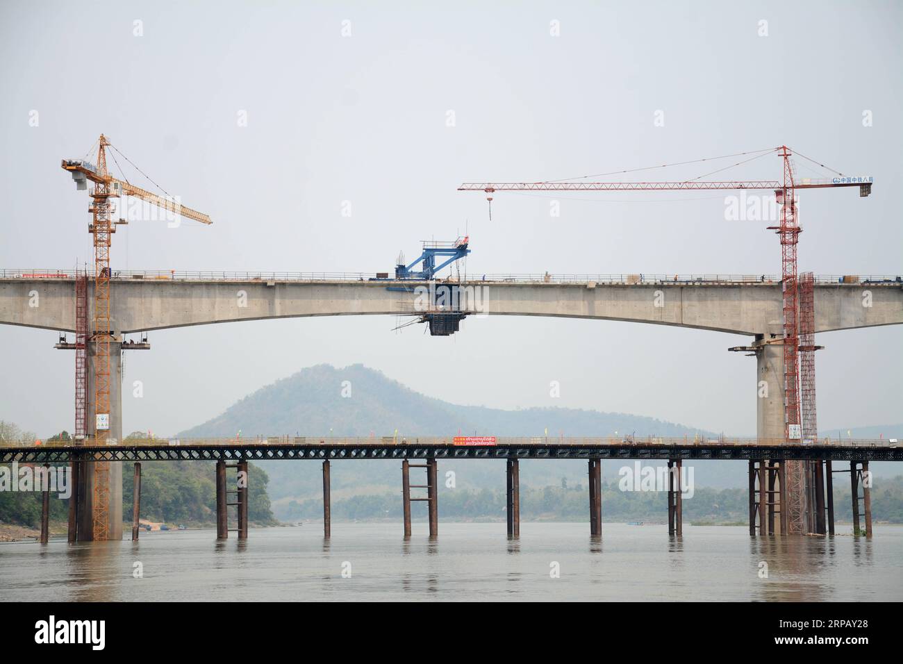 (190521) -- LAOS, May 21, 2019 (Xinhua) -- Photo taken on May 21, 2019 shows the Luang Prabang cross-Mekong River railway bridge in northern Laos. The first bridge span of the China-Laos railway has been built over the Mekong River in northern Laos, the Laos-China Railway Co., Ltd., which is in charge of the construction and operation of the railway said on Tuesday. Accordingly, the China Railway No. 8 Engineering Group (CREC-8) has completed the closure of the first span of the Luang Prabang cross-Mekong River railway bridge on Saturday. It is also the first completed bridge span of two cross Stock Photo