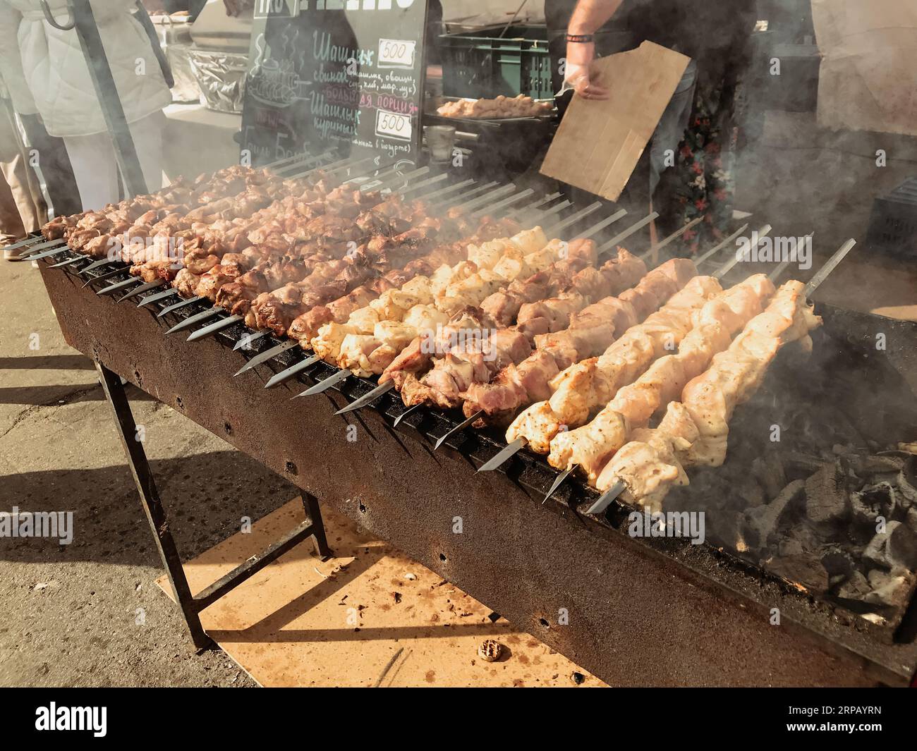 chicken kebabs, lamb, beef on skewers, on the grill, smoky coals, fry