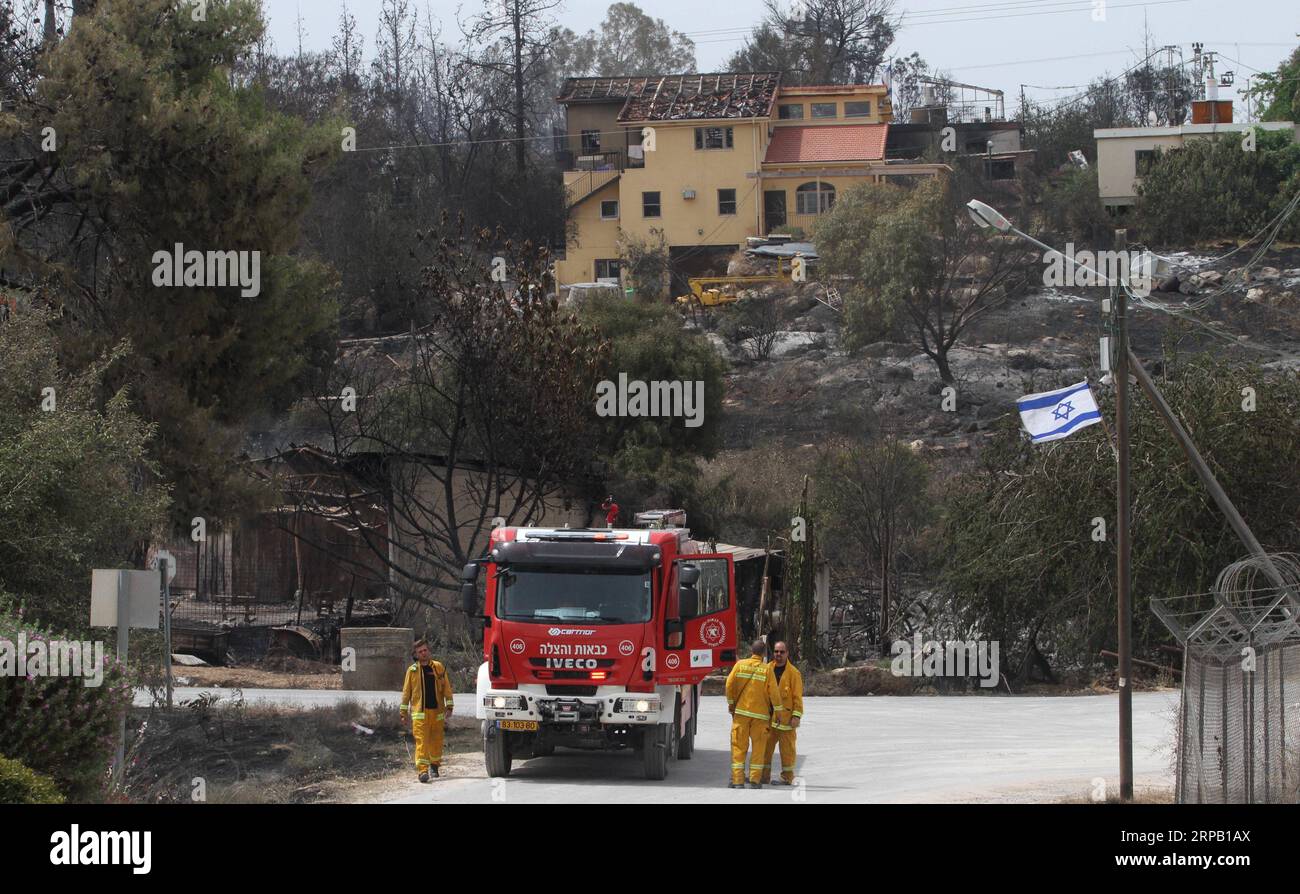 (190524) -- MEVO MODI IM, May 24, 2019 -- Firefighters check loss and damage following a fire amidst extreme heat wave in the village of Mevo Modi im, Israel, May 24, 2019. The Israeli government said it is asking for international aid to fight dozens of huge fires that broke out on Thursday because of extreme hot weather of more than 40 degrees Celsius. ) ISRAEL-MEVO MODI IM-FIRE-DAMAGE GilxCohenxMagen PUBLICATIONxNOTxINxCHN Stock Photo