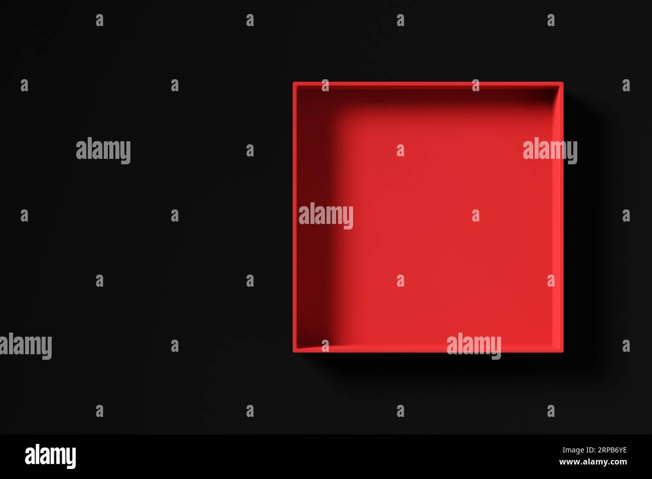 Top view of a red empty gift box on black background with copy space ...