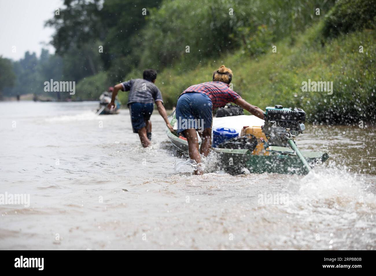 (190603) -- TAMANTHI, June 3, 2019 (Xinhua) -- Researchers commute between their campsites on water in the Tamanthi Wildlife Sanctuary in north Myanmar, May 24, 2019. A China-Myanmar joint field expedition, made up with researchers from the Southeast Asia Biodiversity Research Institute of the Chinese Academy of Sciences (CAS-SEABRI) and the Natural Resources and Environmental Conservation of Myanmar, is doing researches on the biodiversity of the Tamanthi Wildlife Sanctuary in northern Myanmar. The expedition, the eighth of its kind since 2014, began on May 14 and will last till June 15. (Xin Stock Photo