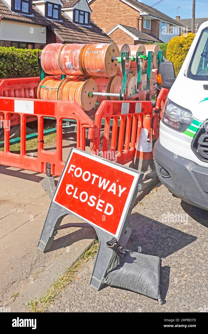 Footway Closed sign housing pavement shut by red plastic road