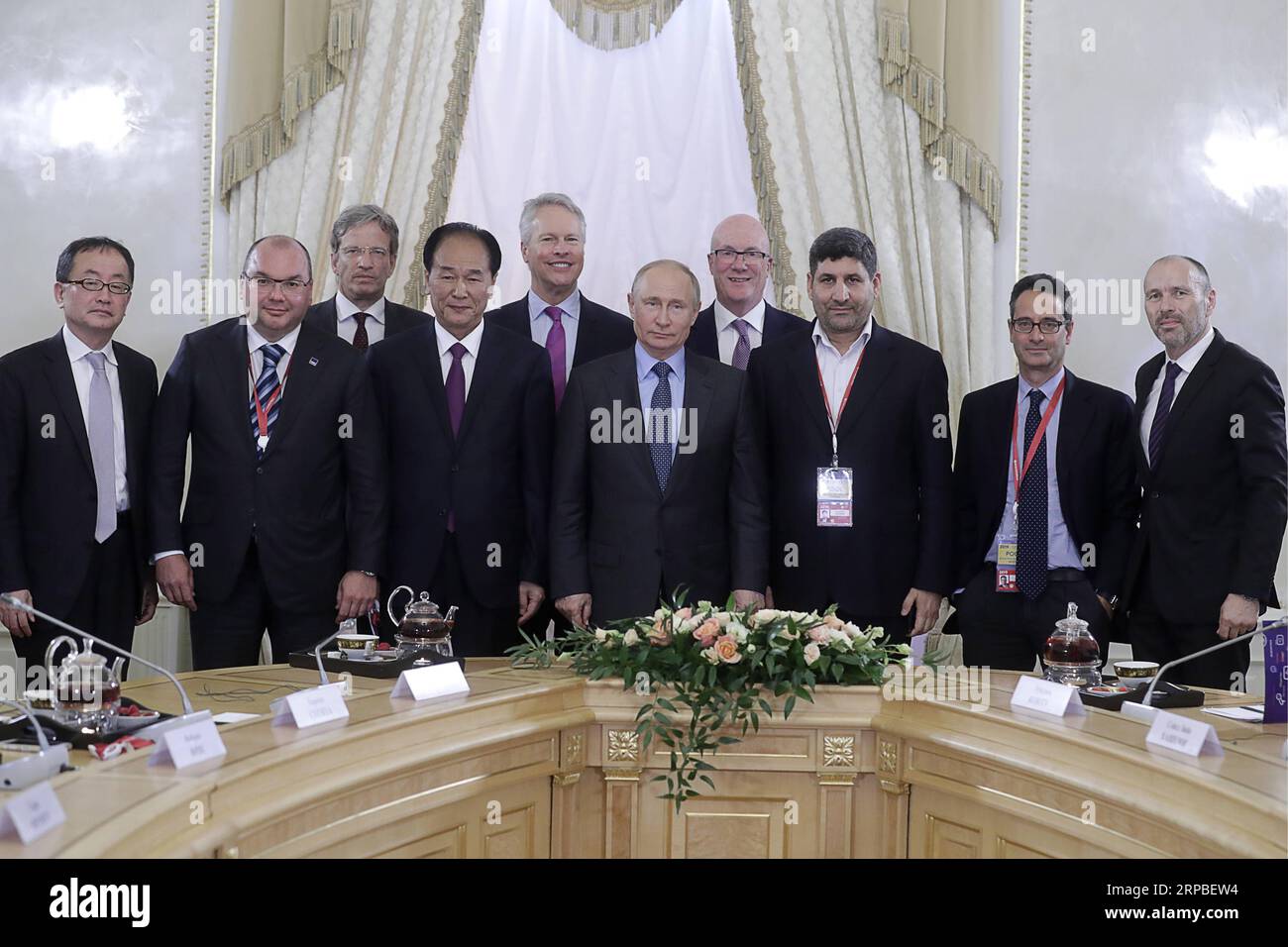 (190607) -- ST. PETERSBURG, June 7, 2019 -- Russian President Vladimir Putin (5th R) takes group photo with President of China s Xinhua News Agency Cai Mingzhao (4th L) and other heads of news agencies in St. Petersburg, Russia, June 6, 2019. The Russian economy has entered a trajectory of sustainable growth as a result of an improving economic environment and the implementation of strategic national projects, Russian President Vladimir Putin said Thursday. We have not only overcome the decline, but we have stepped on a trajectory of sustainable growth, he said on the sidelines of the 23rd St. Stock Photo