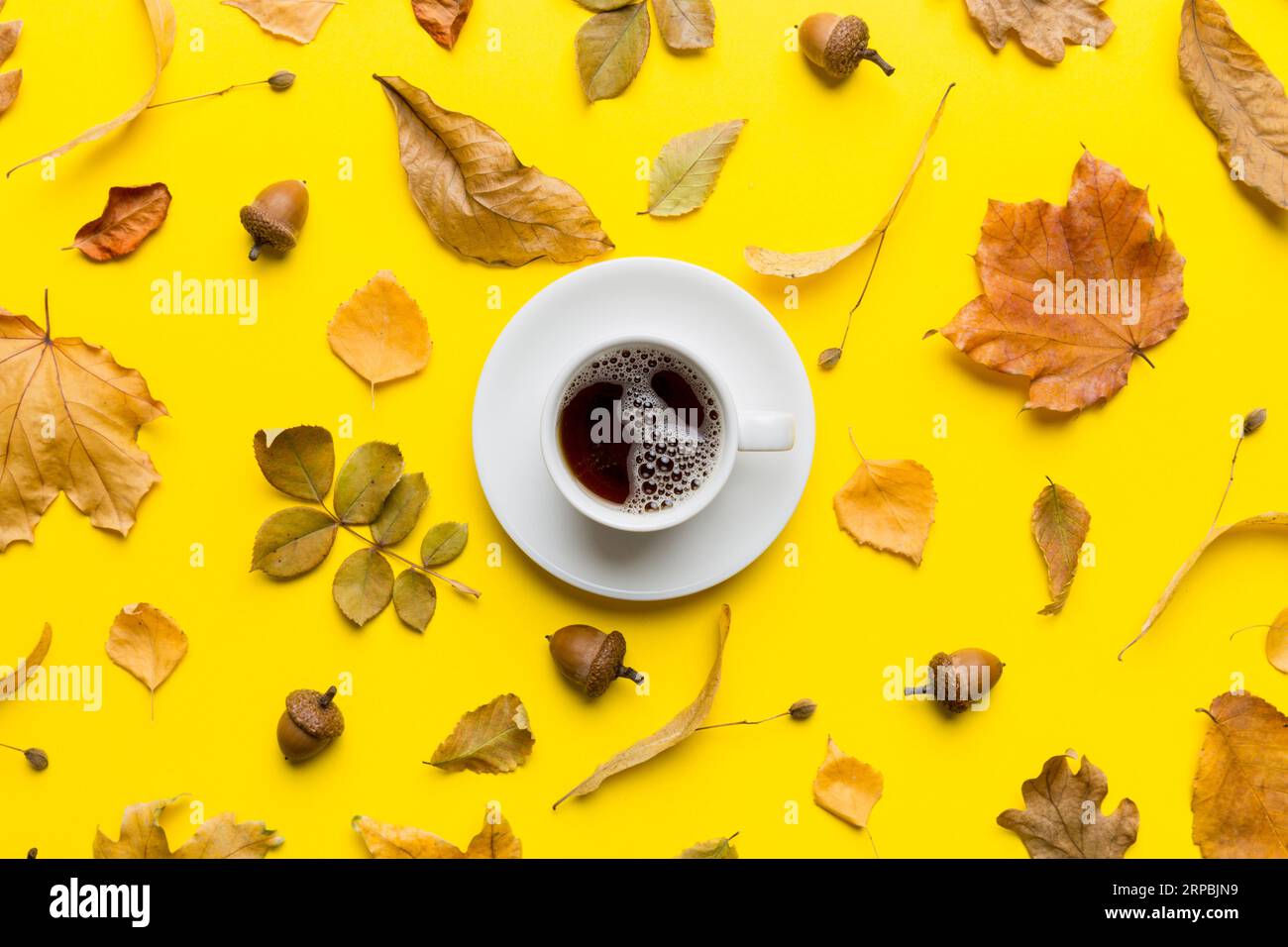 Flat lay composition with colorful Autumn cup of coffee and leaves on a ...