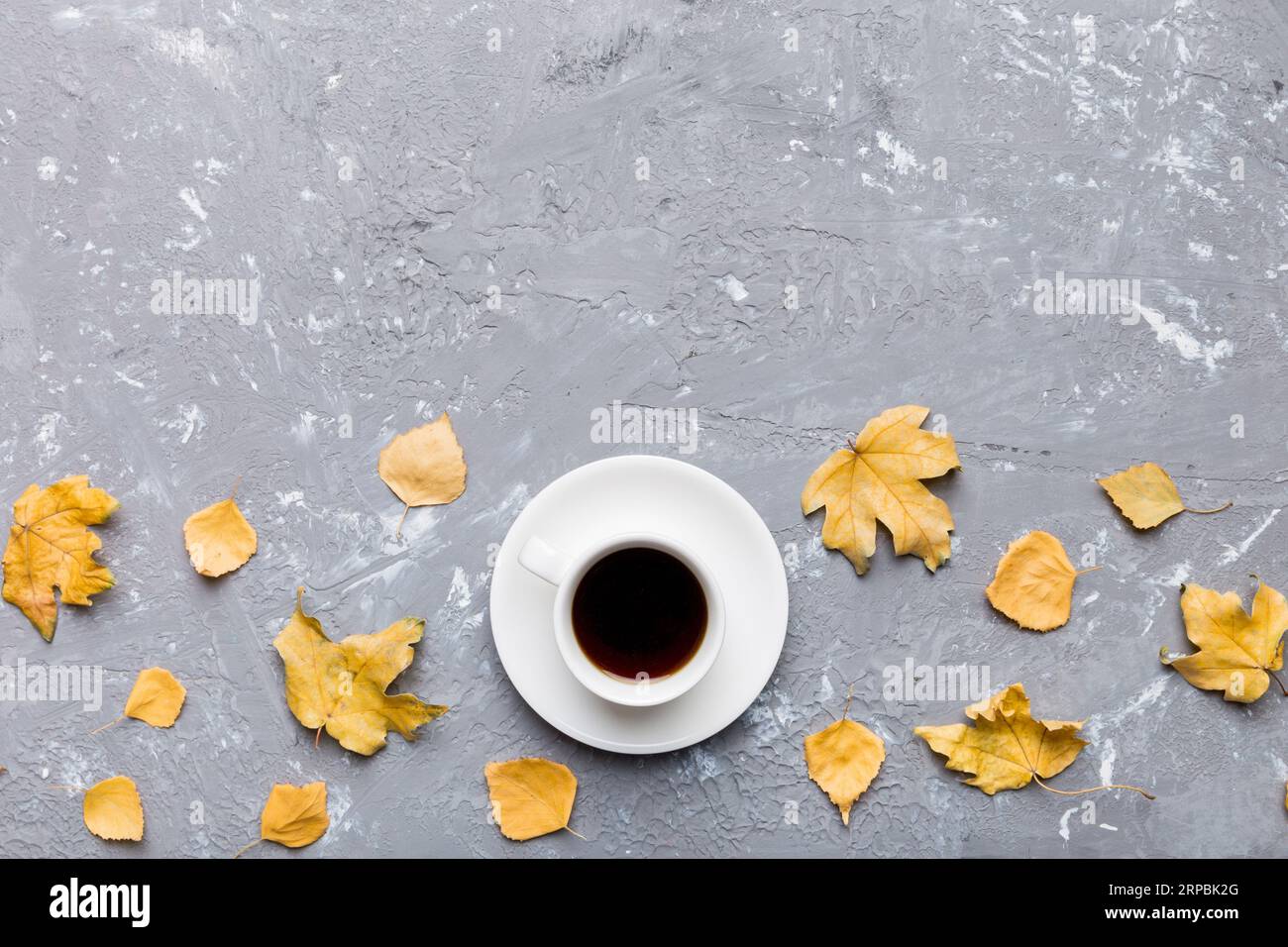 Flat lay composition with colorful Autumn cup of coffee and leaves on a ...