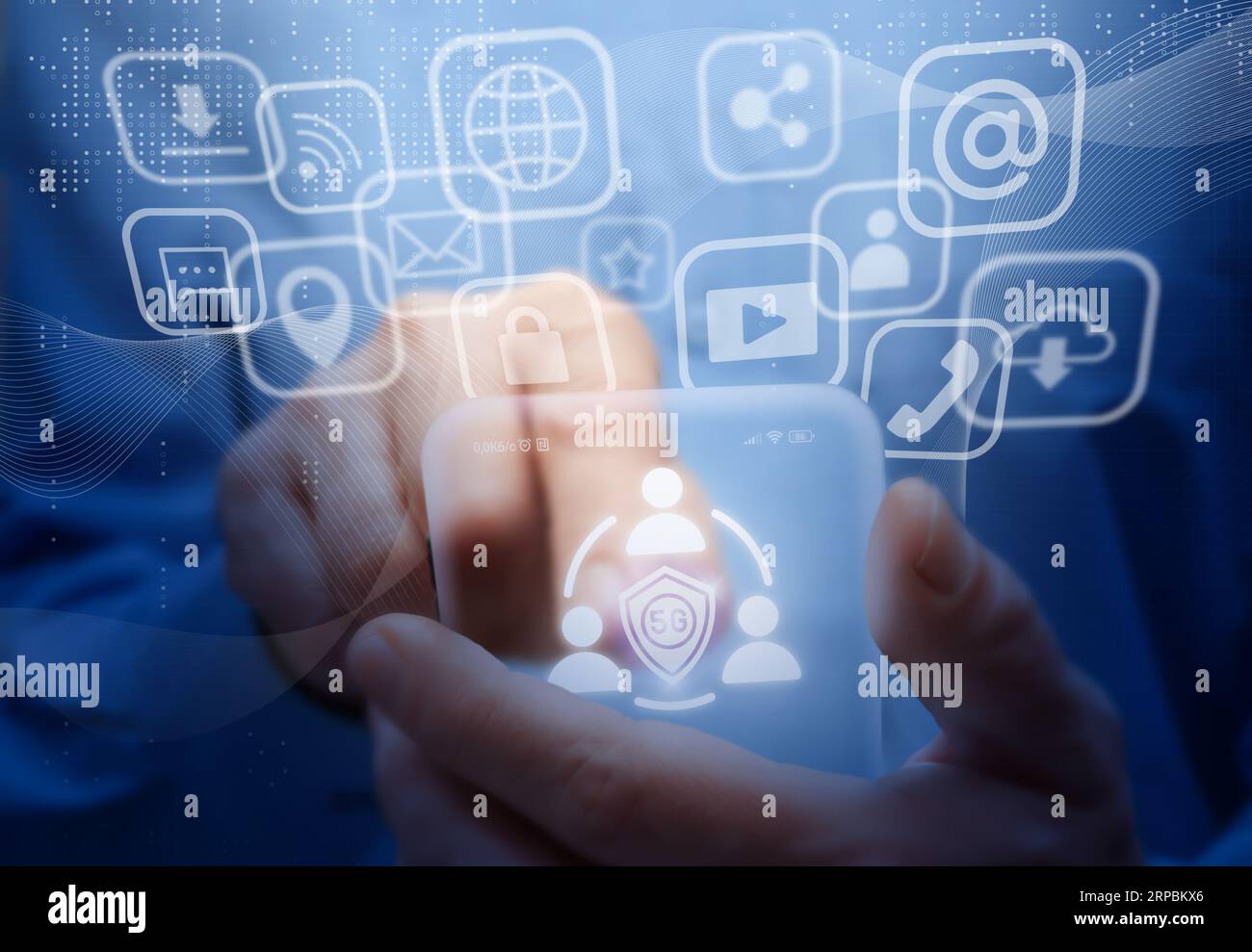 Man holds virtual mobile phone. Symbols and icons of 5G mobile internet, social networks, emails, cloud storage, multimedia services and so on. Mobile Stock Photo