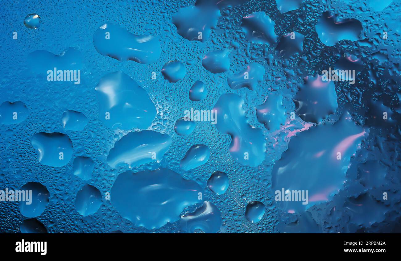 Water drops on a glass surface close up Stock Photo