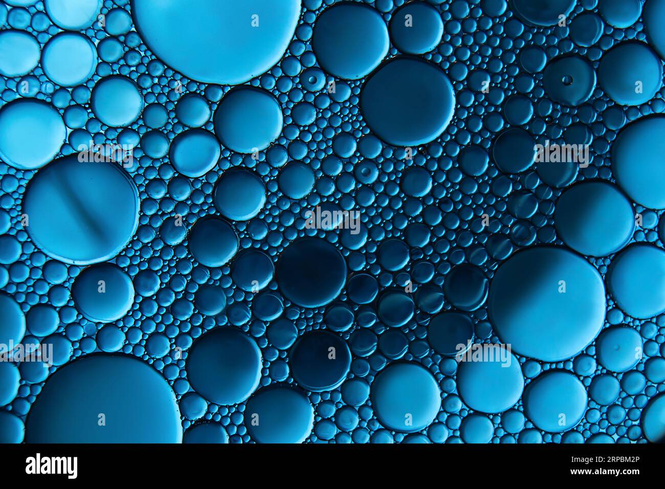 Macrophoto of oil droplets and bubbles on a water surface Stock Photo ...