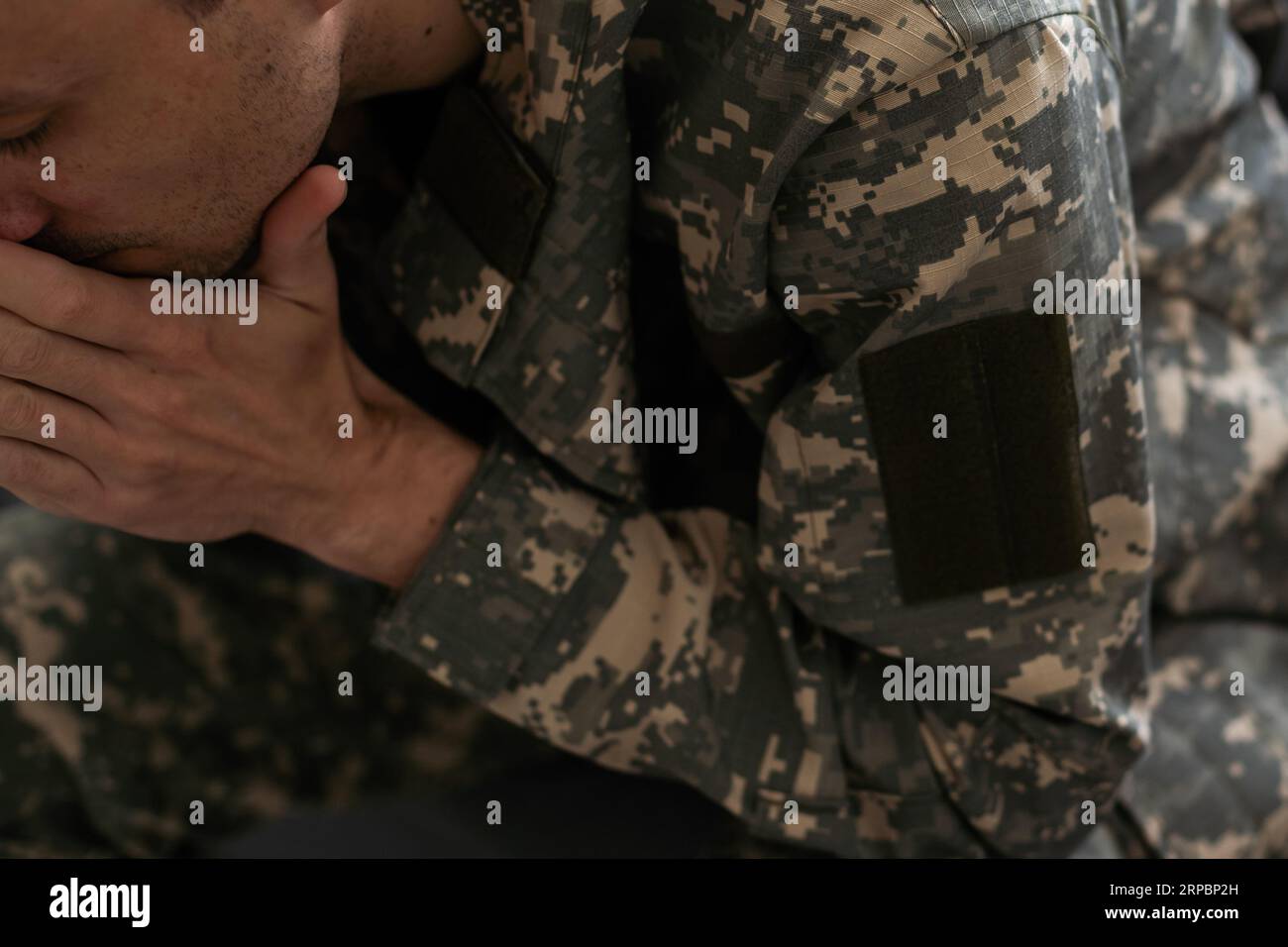 Portrait of middle aged sad, desperate military man. Disabled soldier suffering from depression psychological trauma. PTSD concept. Stock Photo